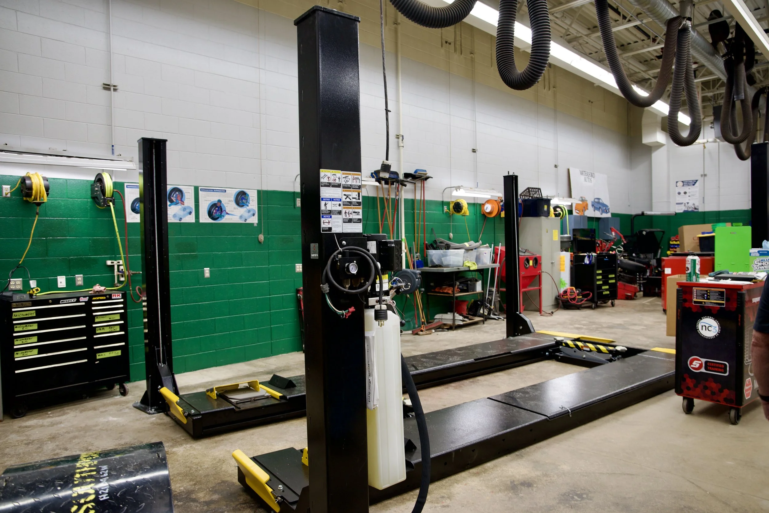The autos shop has a new car lift. 