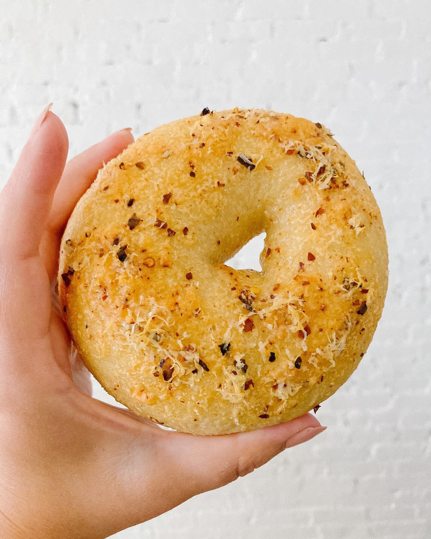We have been loving this Spicy Parmesan Bagel. Question is, toasted with cream cheese, or a breakfast sandwich with bacon and egg?  #bagels #mainebreakfast