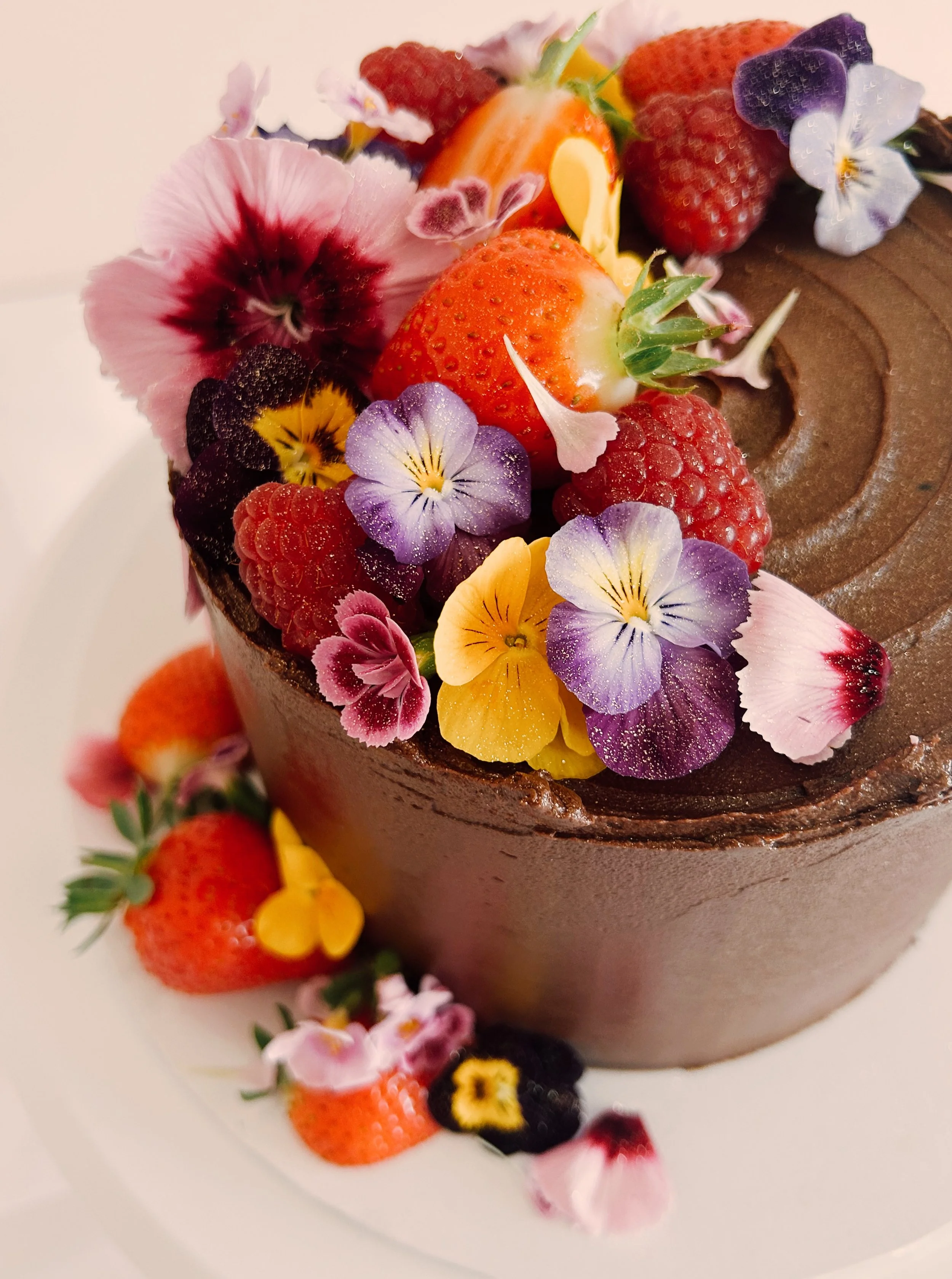 Chocolate cake with edible flowers
Tara Katie Cakes