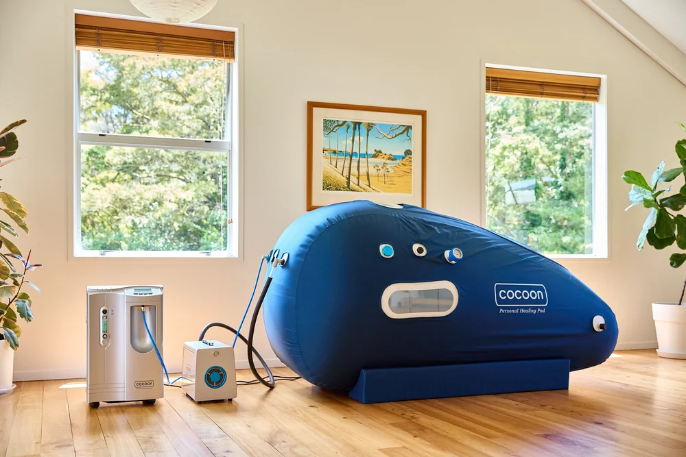 Cocoon hyperbaric oxygen chamber set up in a home living room