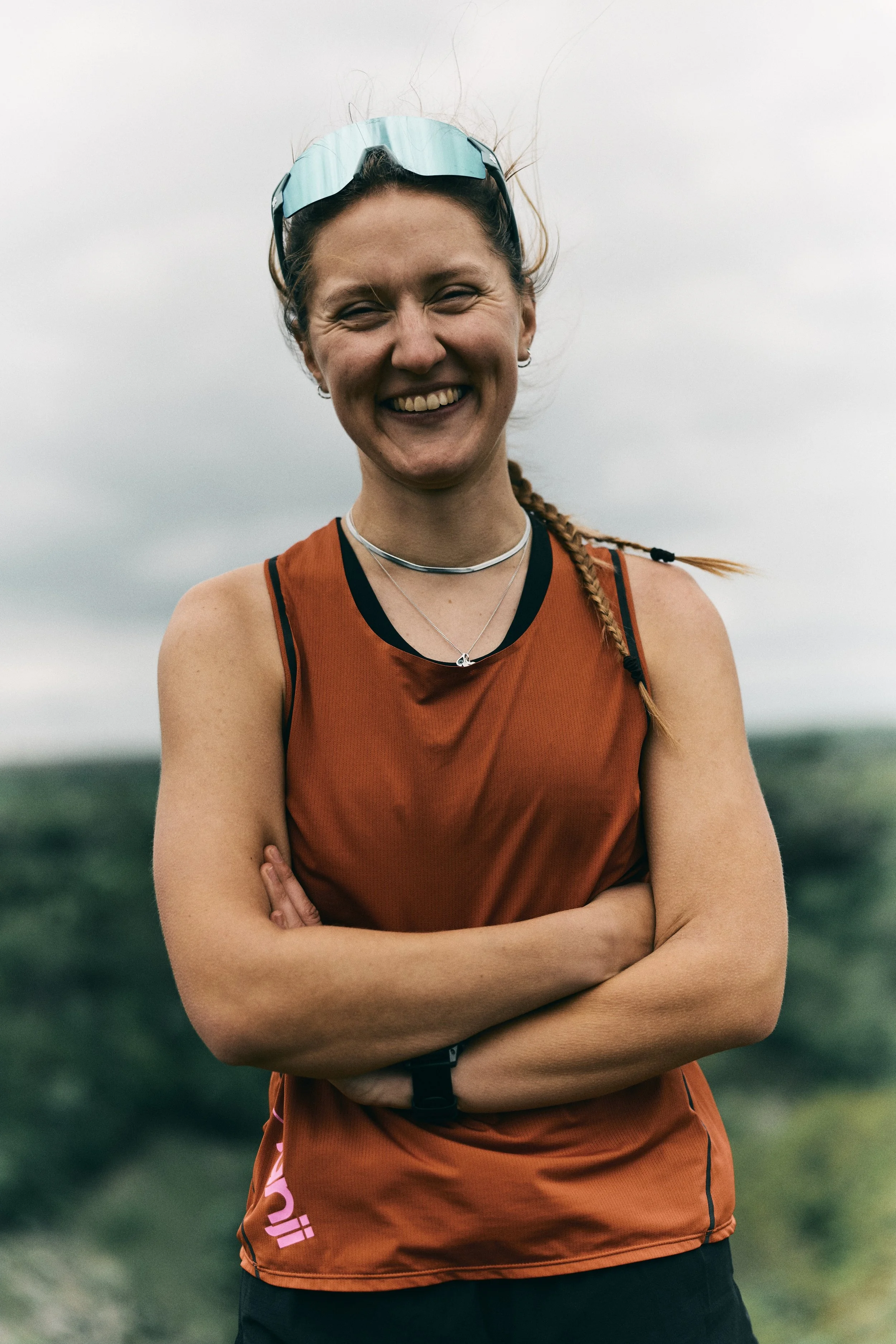 Female trail runner posing smiling