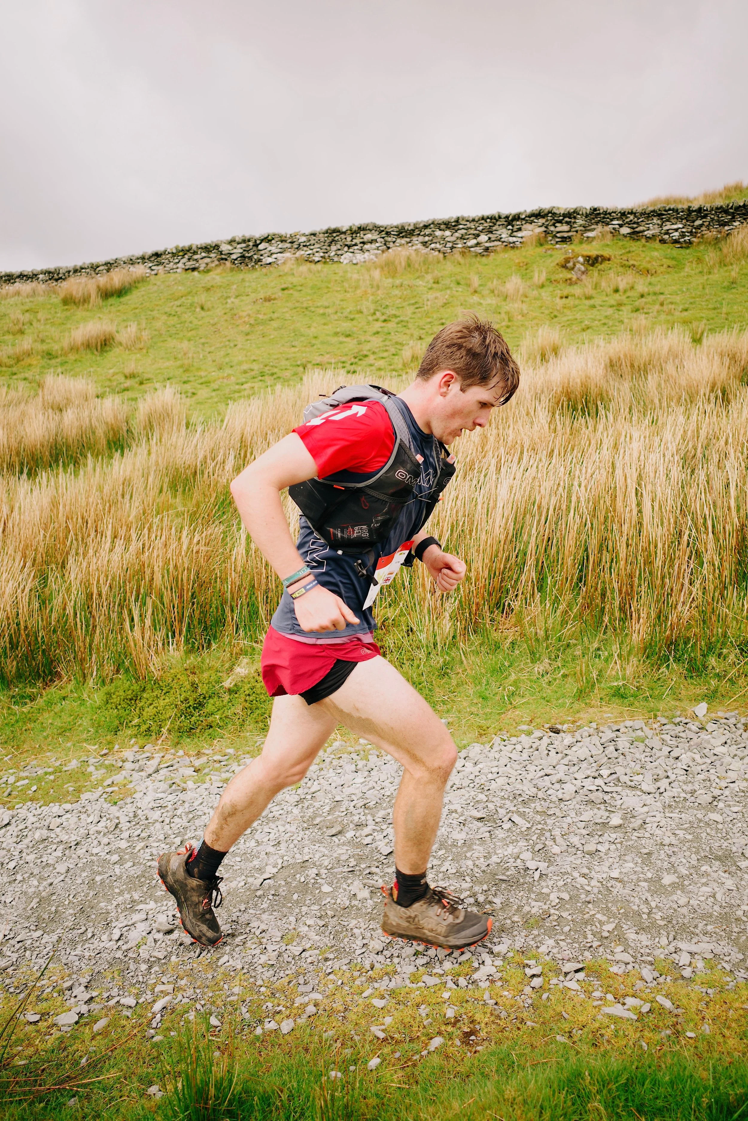 Trail runner climbing up a hill