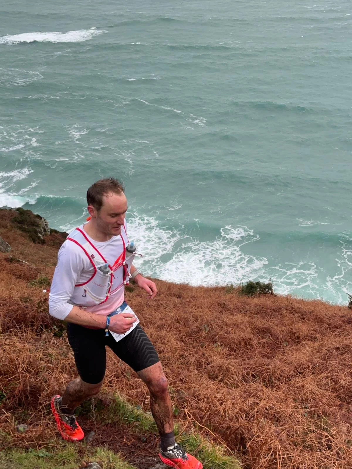 Runner battles through Storm Ingrid on the Cornish coast during the Arc of Attrition by UTMB