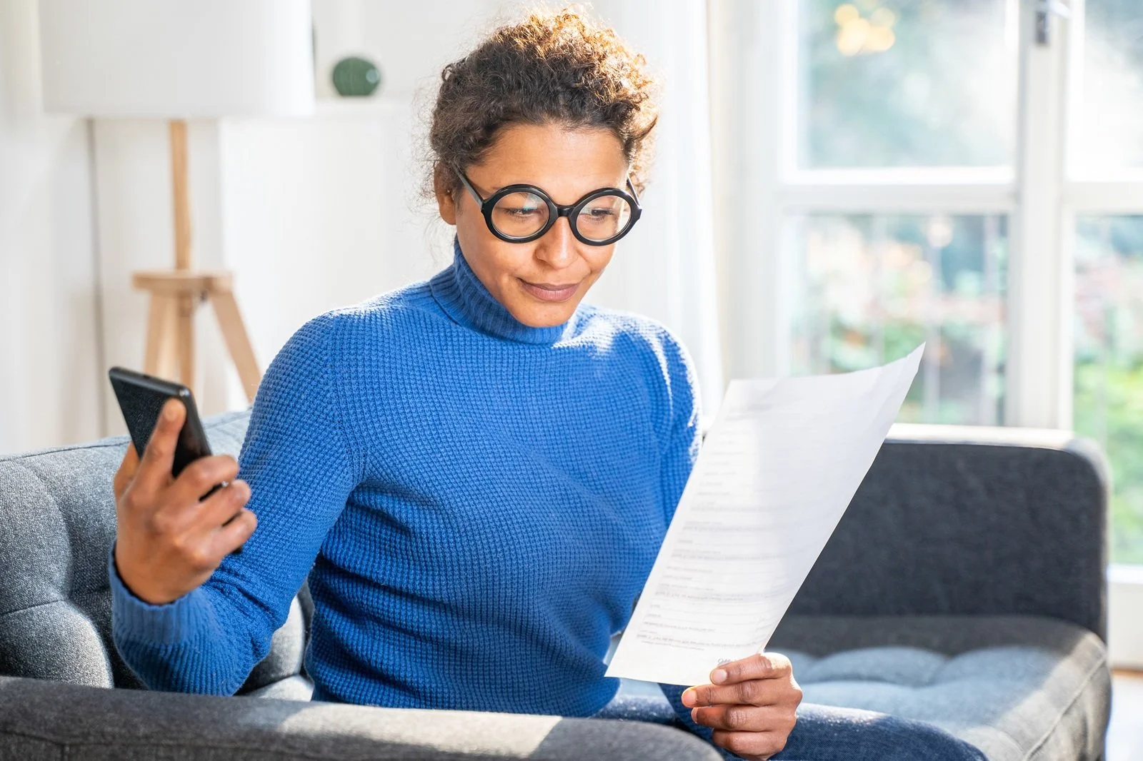 woman reading a piece of paper