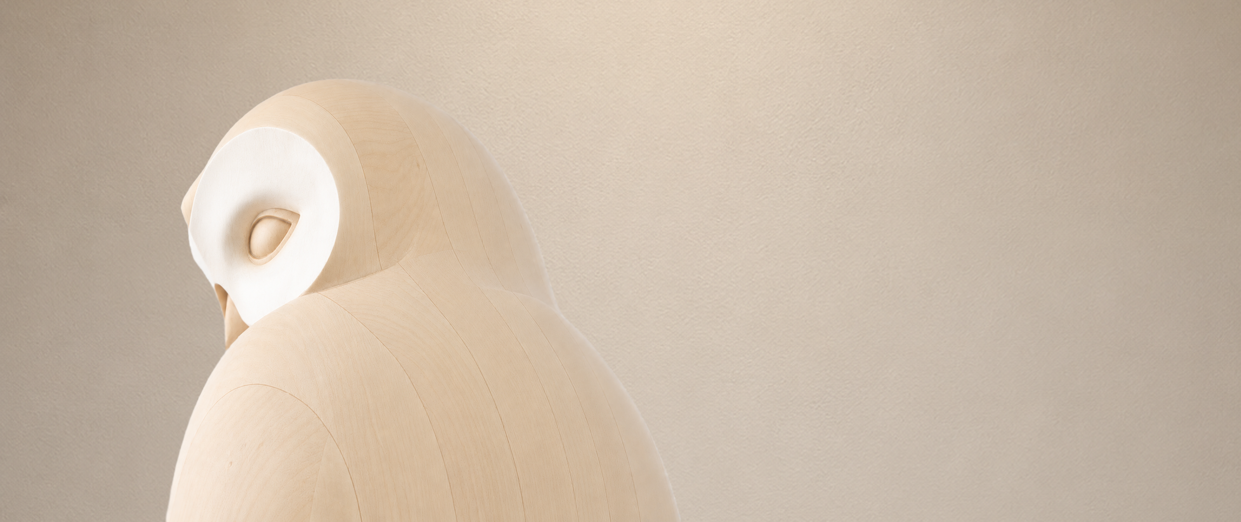 Hand-carved basswood owl sculpture titled Quiet Vigil.
