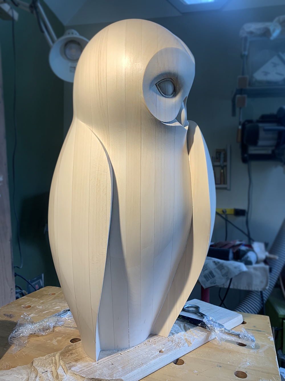 Hand-carved basswood owl sculpture titled Quiet Vigil.