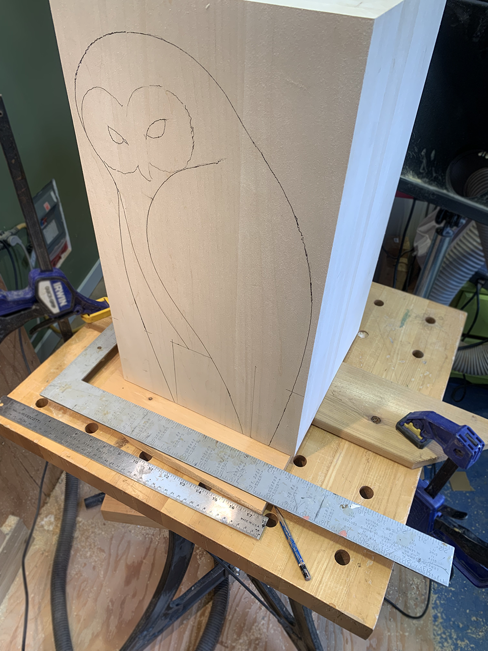 Hand-carved basswood owl sculpture titled Quiet Vigil.
