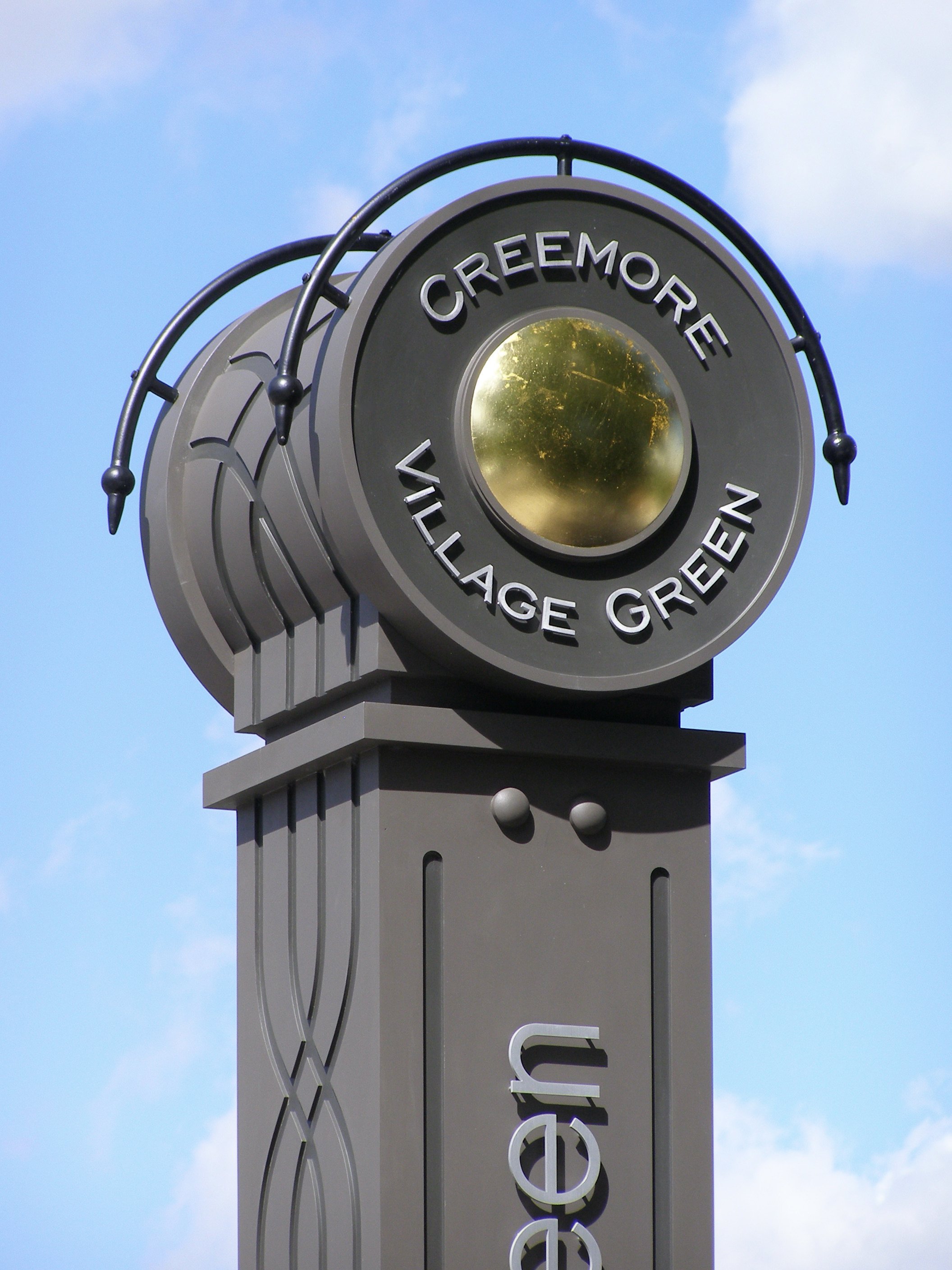 Railway and agricultural motifs carved into the Creemore Village Green monument.