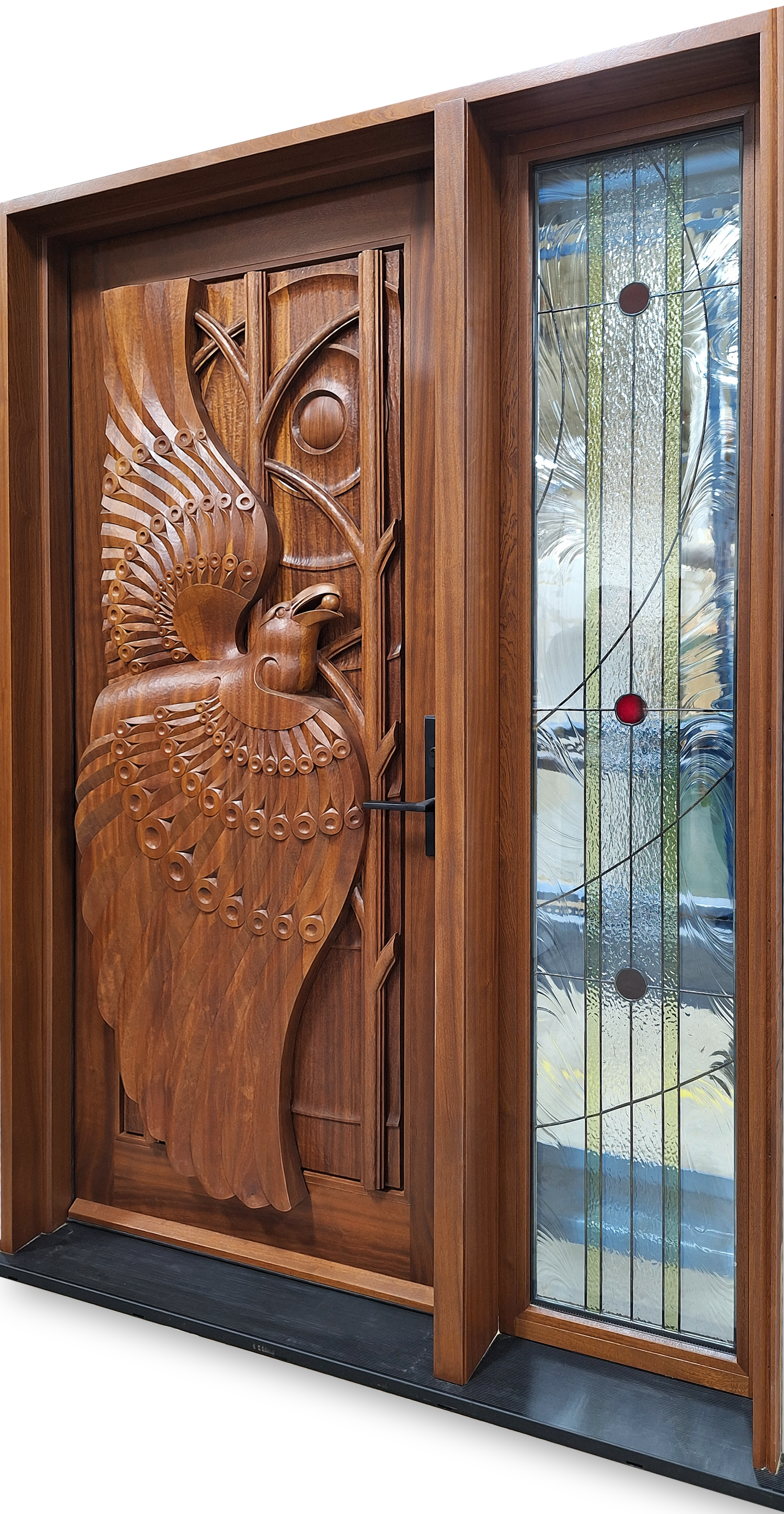 Hand-carved mahogany entrance door inspired by the Inuit story Raven and the Berry