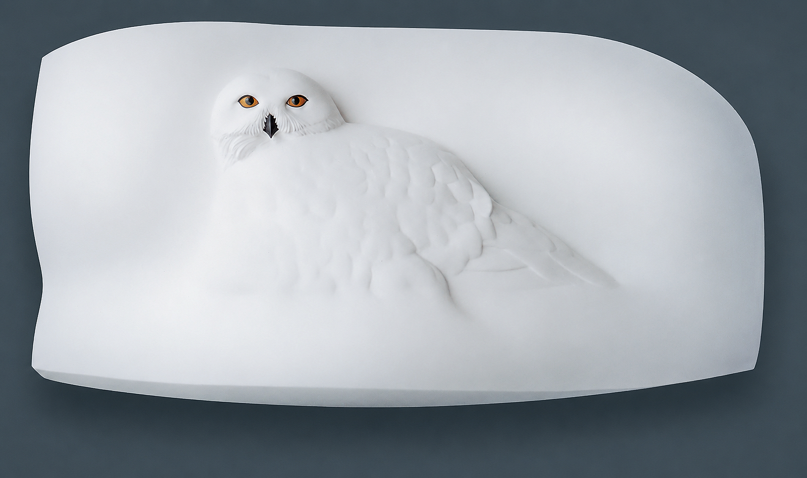 A minimalist snowy owl relief sculpture inspired by northern landscapes, exploring stillness, light, and the quiet presence of winter.