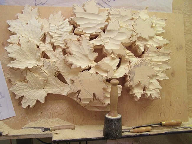 A hand-carved painted pine entrance inspired by Southern Georgian Bay, heritage orchards, and the changing qualities of light.