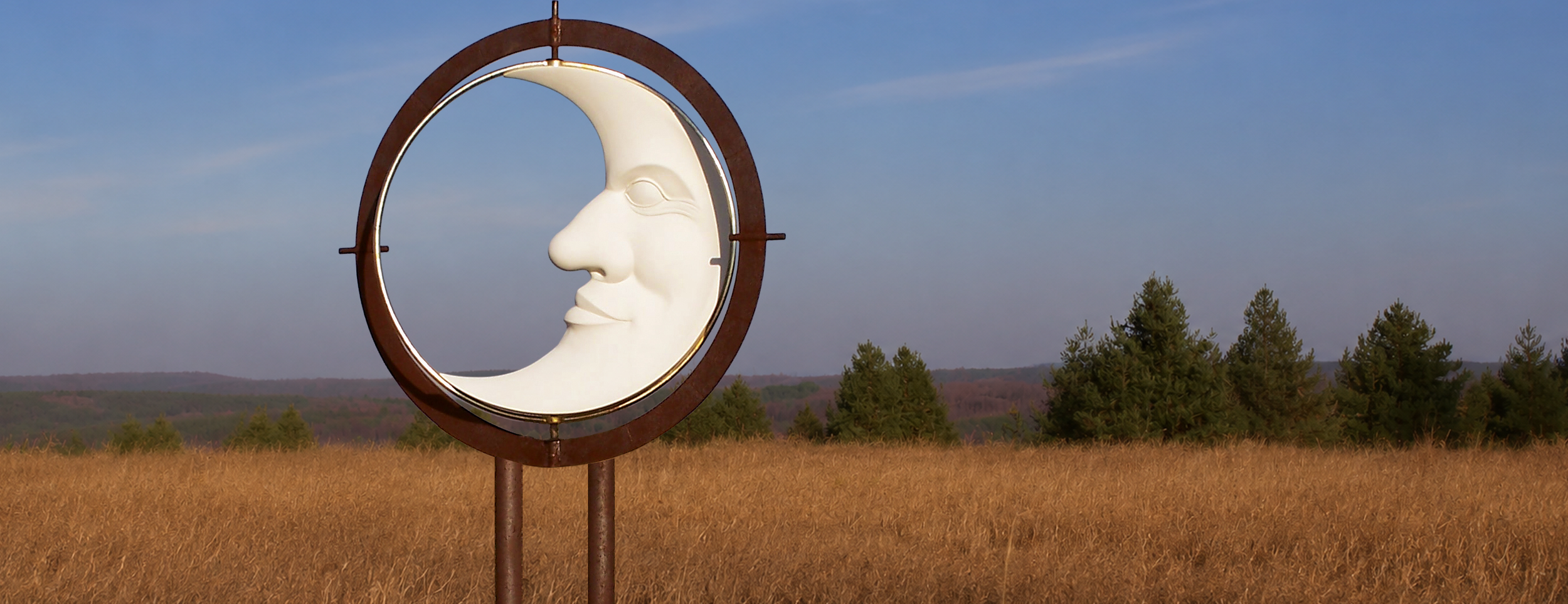 Kinetic moon sculpture rotating above the Saugeen River valley in Ontario.