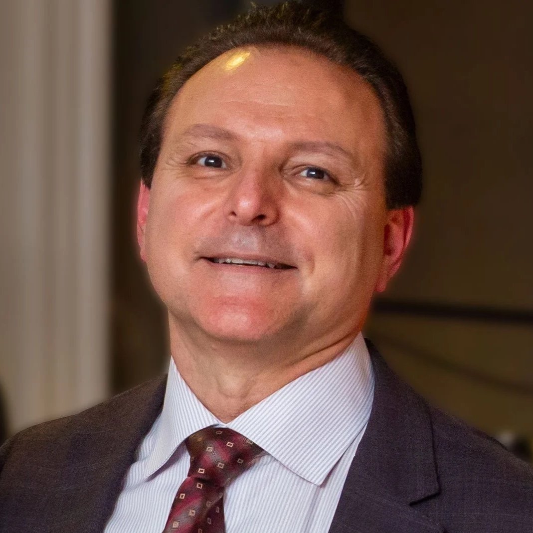 Gerry Montillio in suit and blue shirt