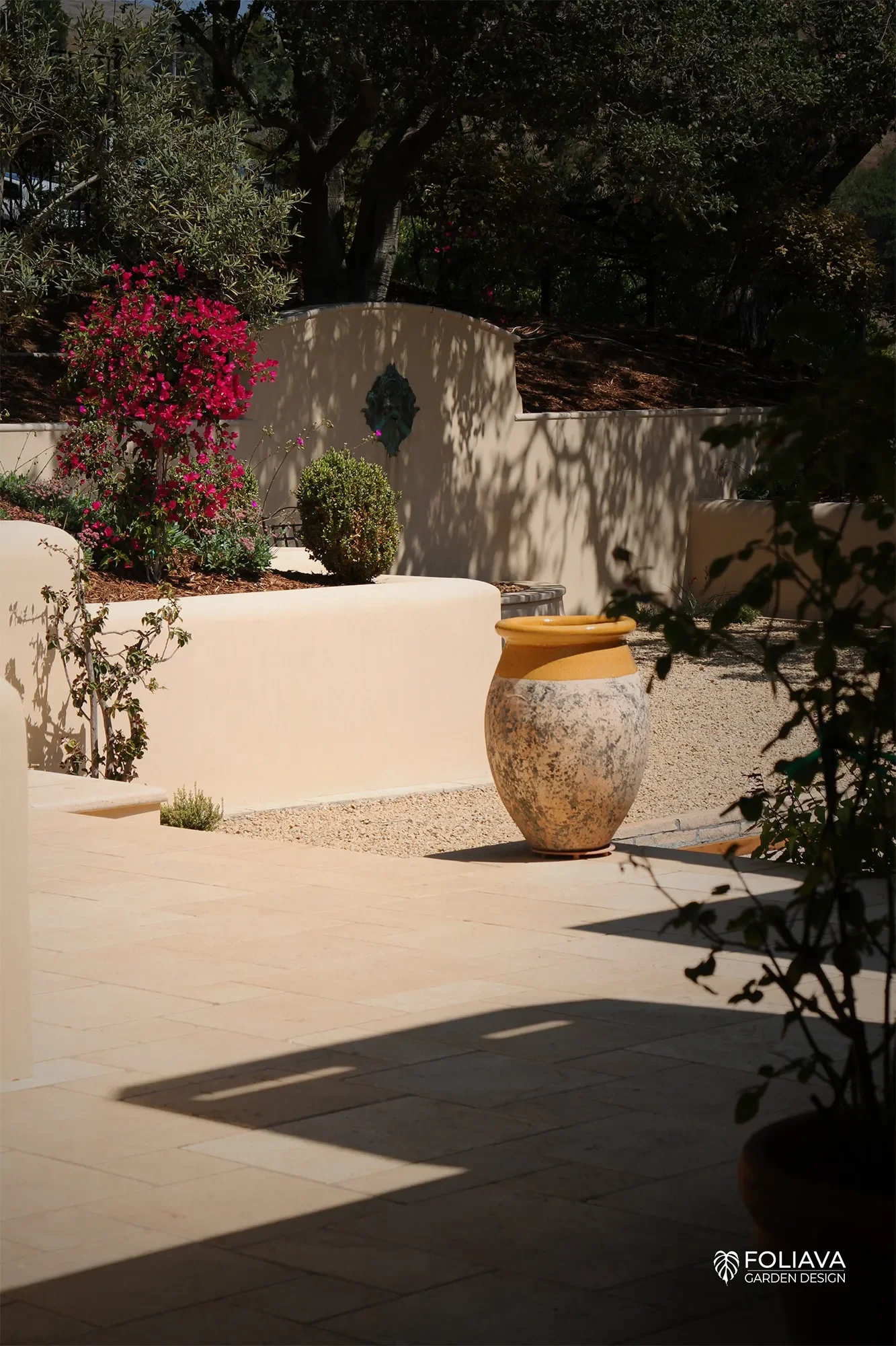 High-end Marin County garden with bocce court, fountain, and climate-adapted planting