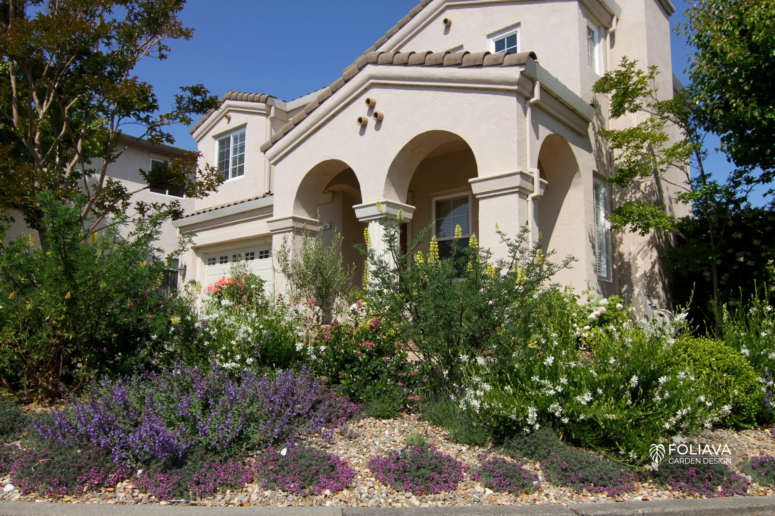 Naturalistic garden design replaces dry turf with abundant blooms.
