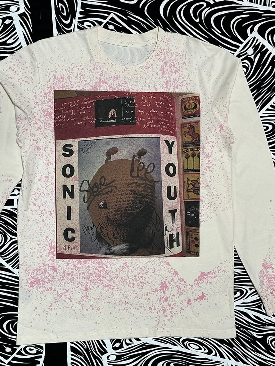 Front view of natural long sleeved tee with oxidised treatment in pink and a large print of Sonic Youth by Sophie Howarth.