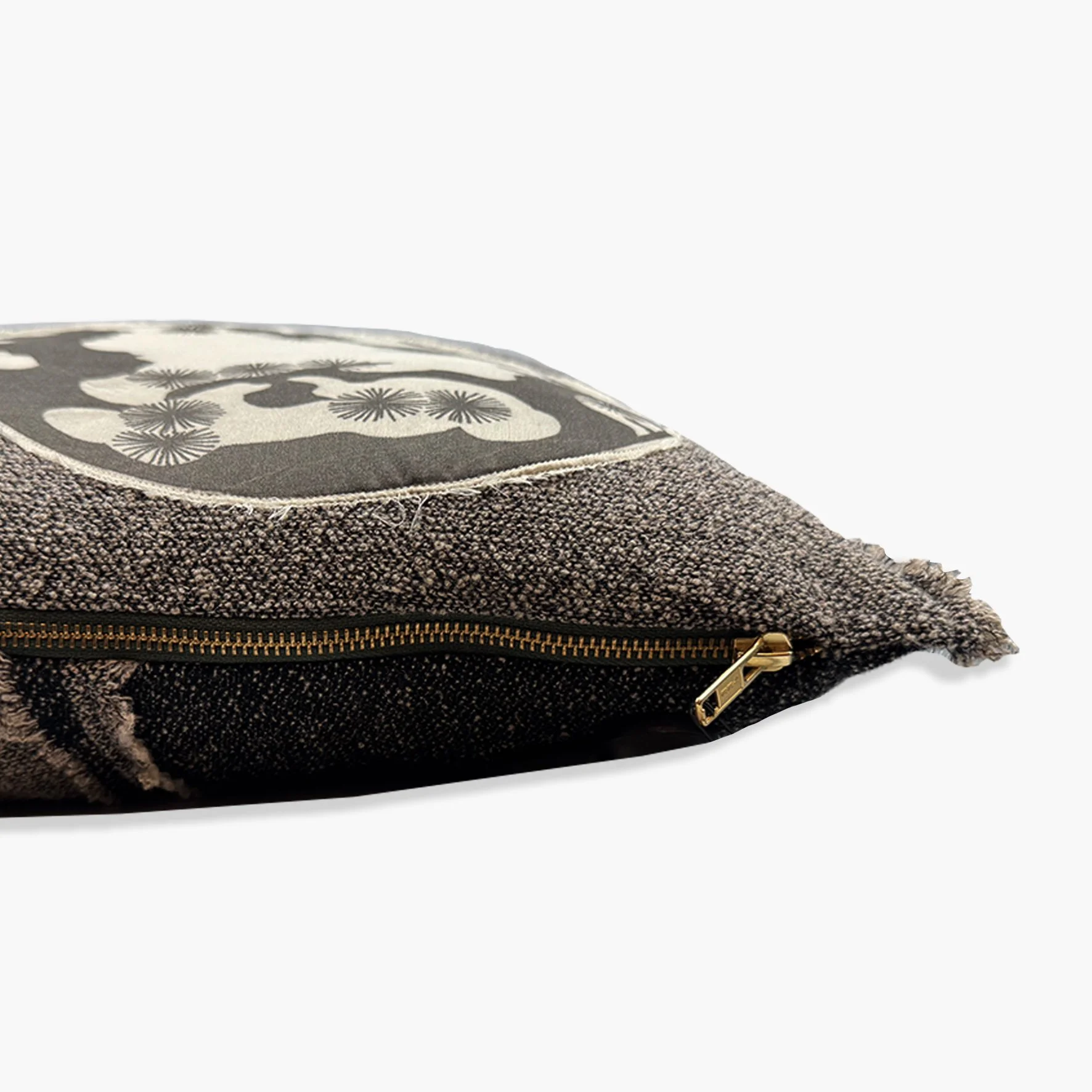 Side view of cushion showing gold YKK zip.