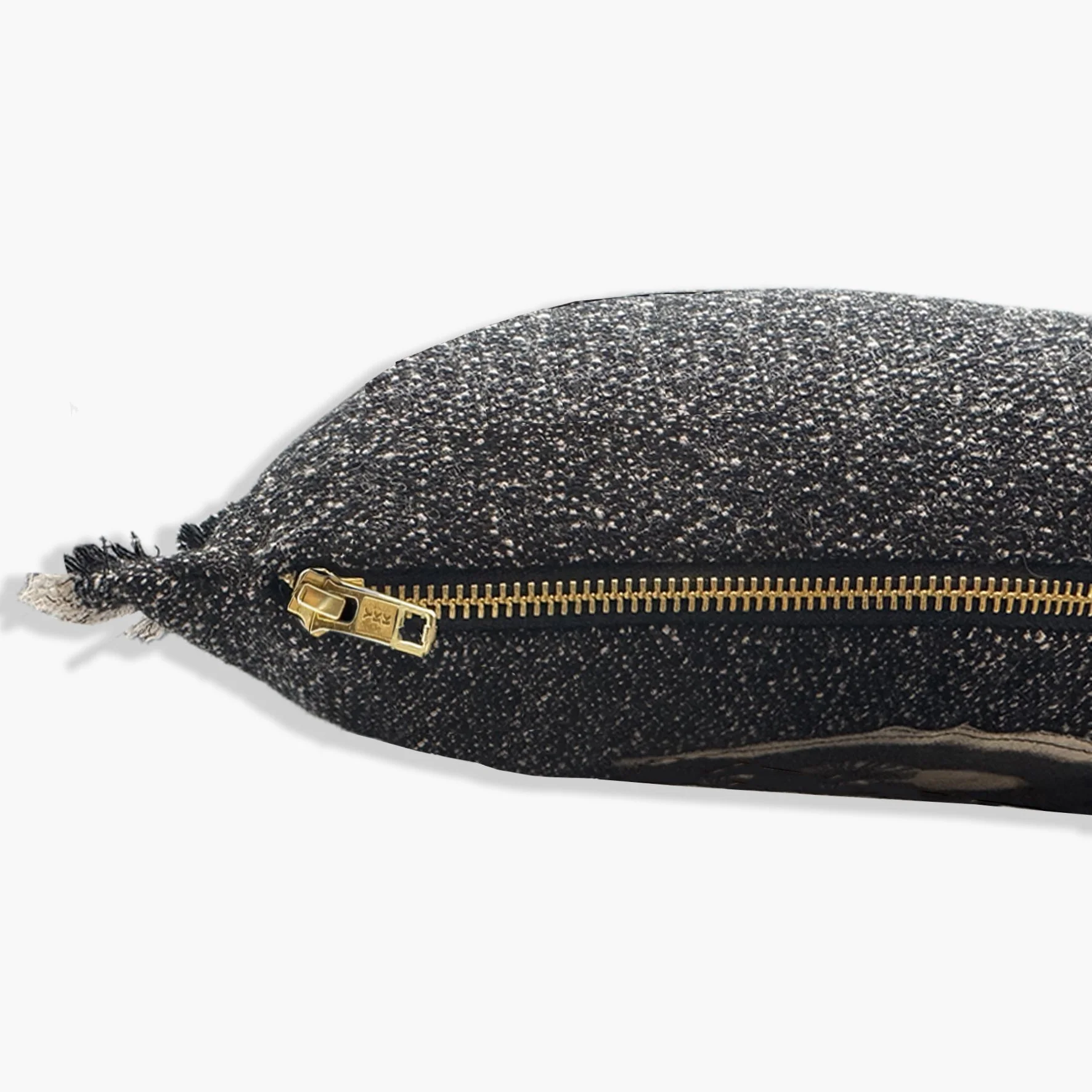 Side view of cushion showing gold YKK zip.