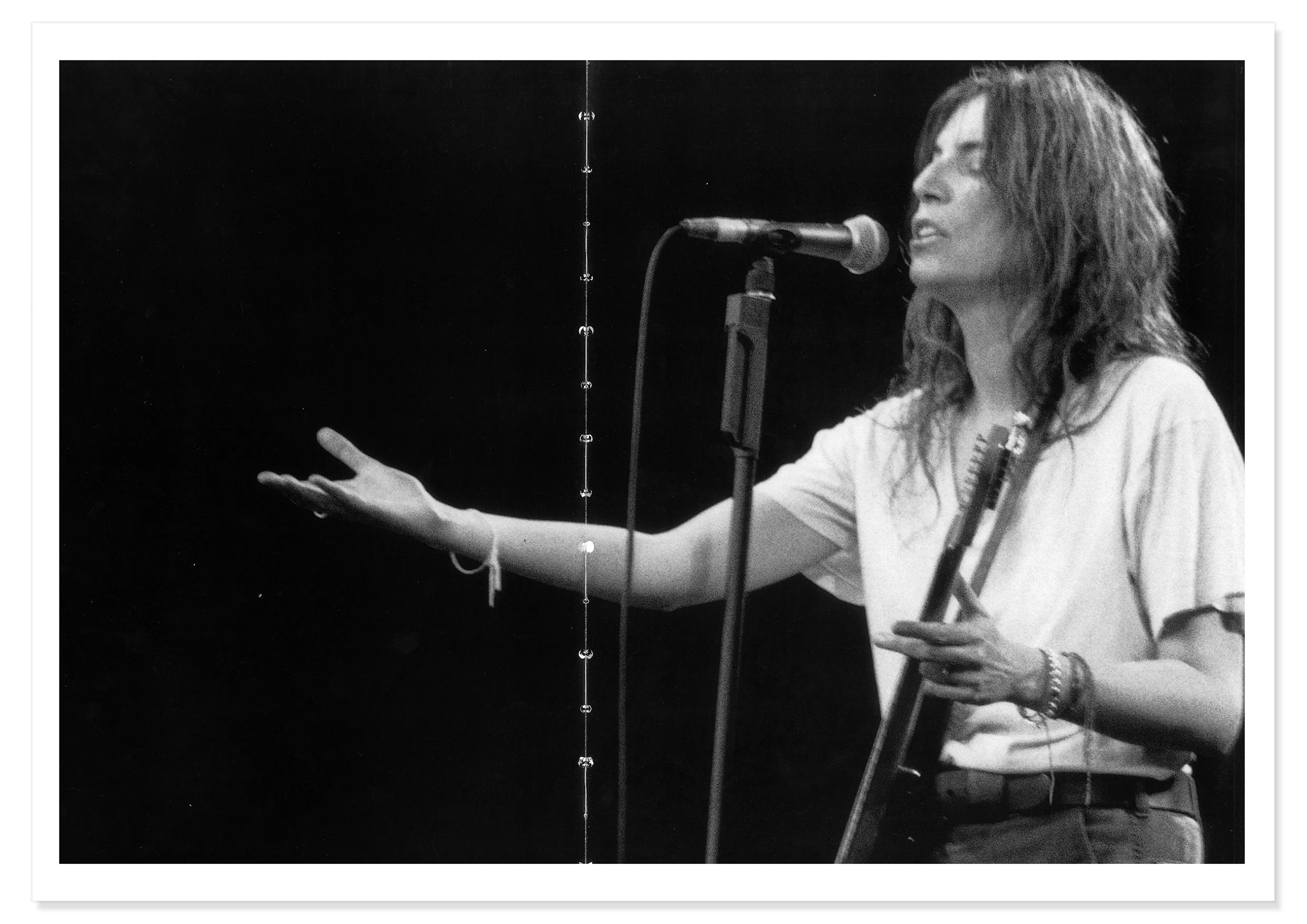 A limited edition black and white photographic print of Patti Smith performing at a Big Day Out concert.  Photographer Sophie Howarth.
