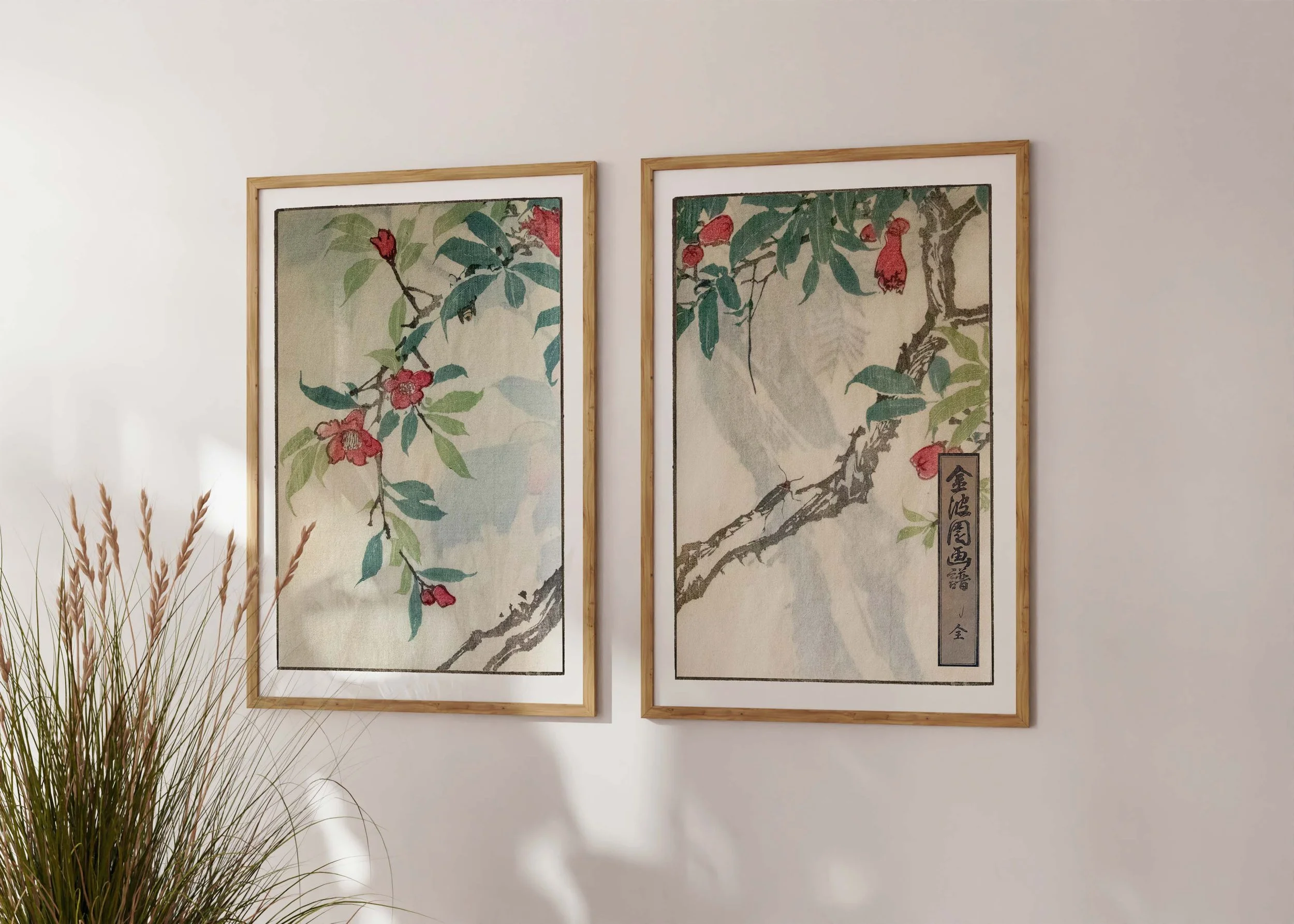 Framed set of two prints of Bunpo Kawamura’s Reddopandoria set with red pandorea-like flowers on a sunlit wall.