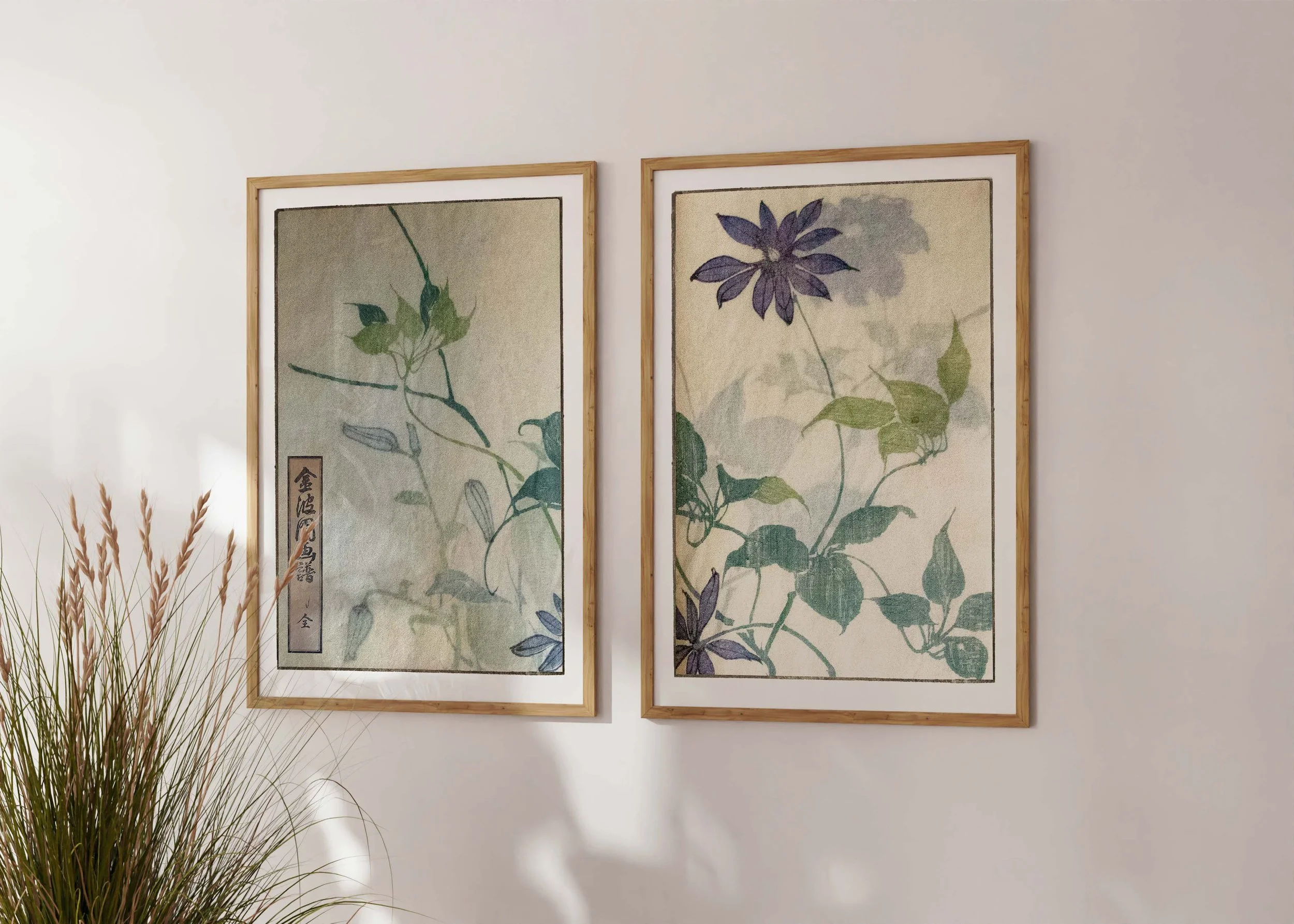 Framed set of two prints of Bunpo Kawamura’s Papurukuremachisu set with purple clematis flowers on a sunlit wall.