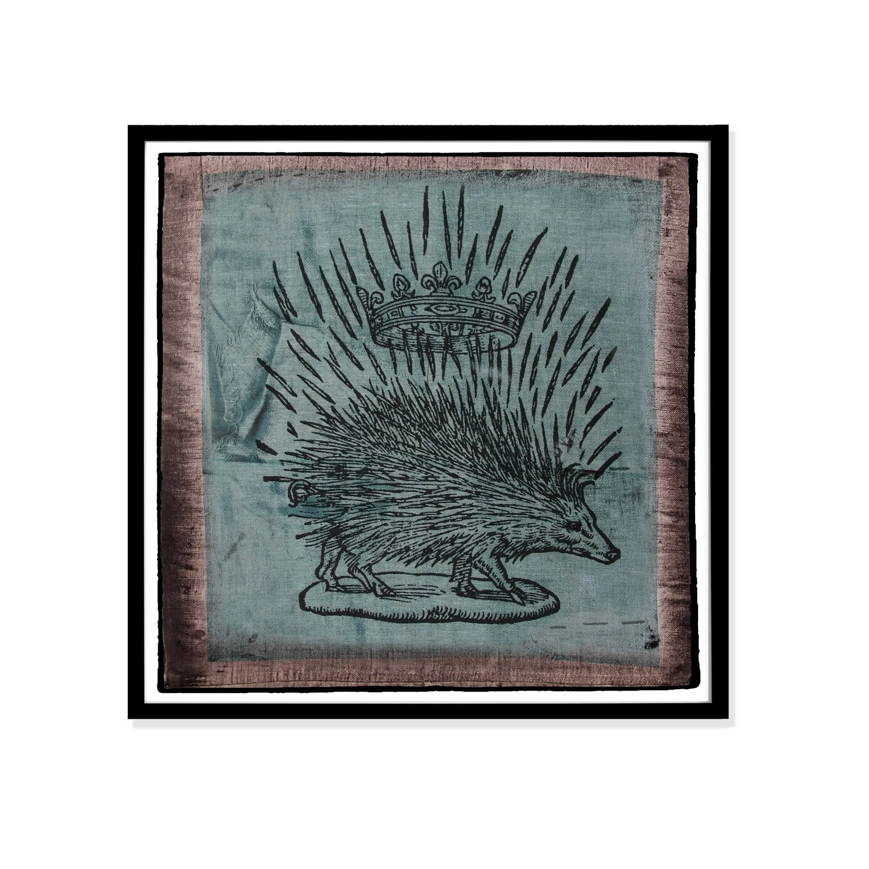 Porcupine illustration by Claude Paradin with antique linen in a black frame against a white wall.
