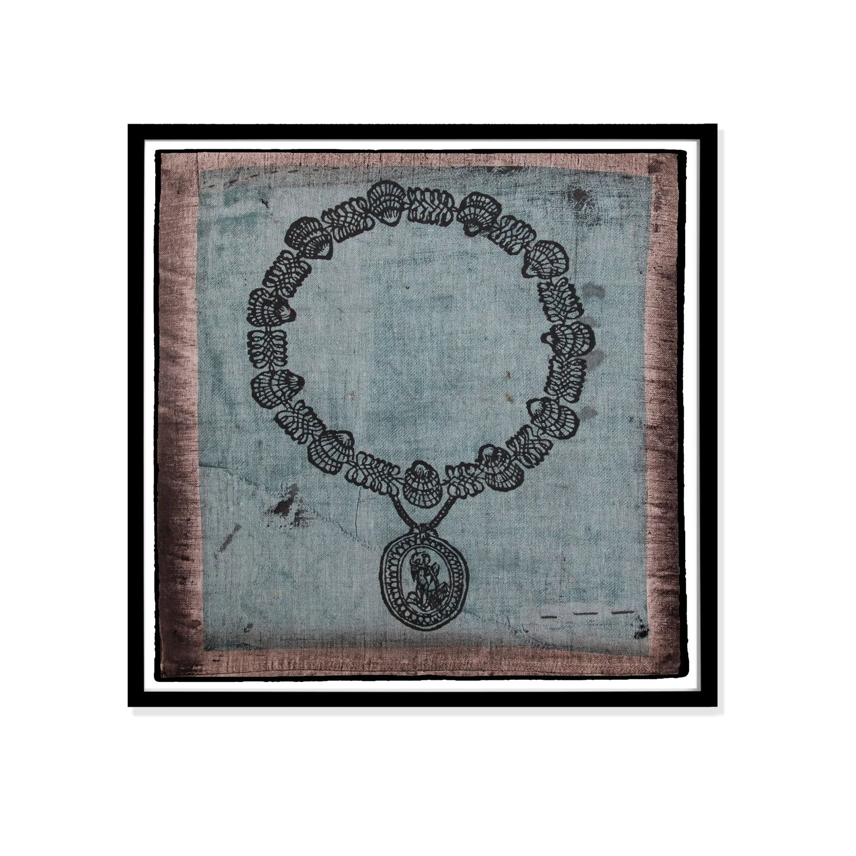 Pendant illustration by Claude Paradin with antique linen in a black frame against a white wall.
