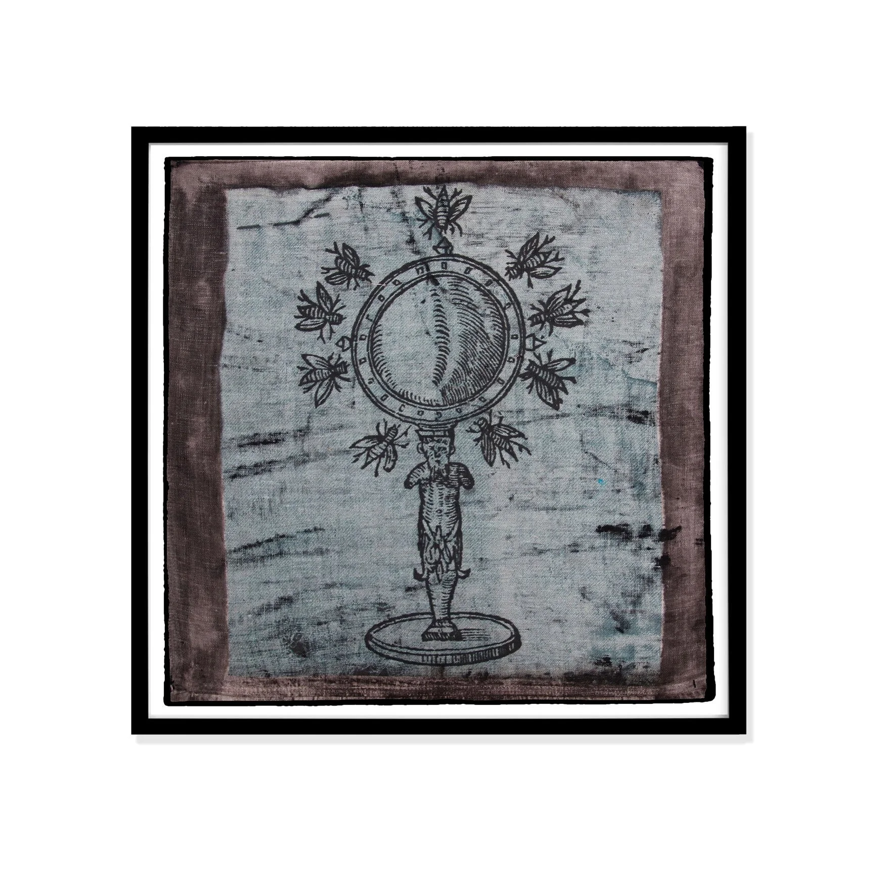 Bee illustration by Claude Paradin with antique linen in a black frame against a white wall.