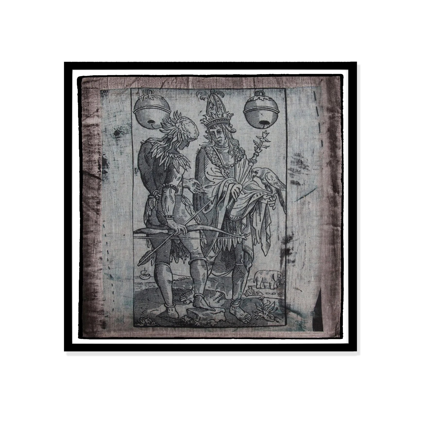 Hunter with elephant illustration by Claude Paradin with antique linen in a black frame against a white wall.