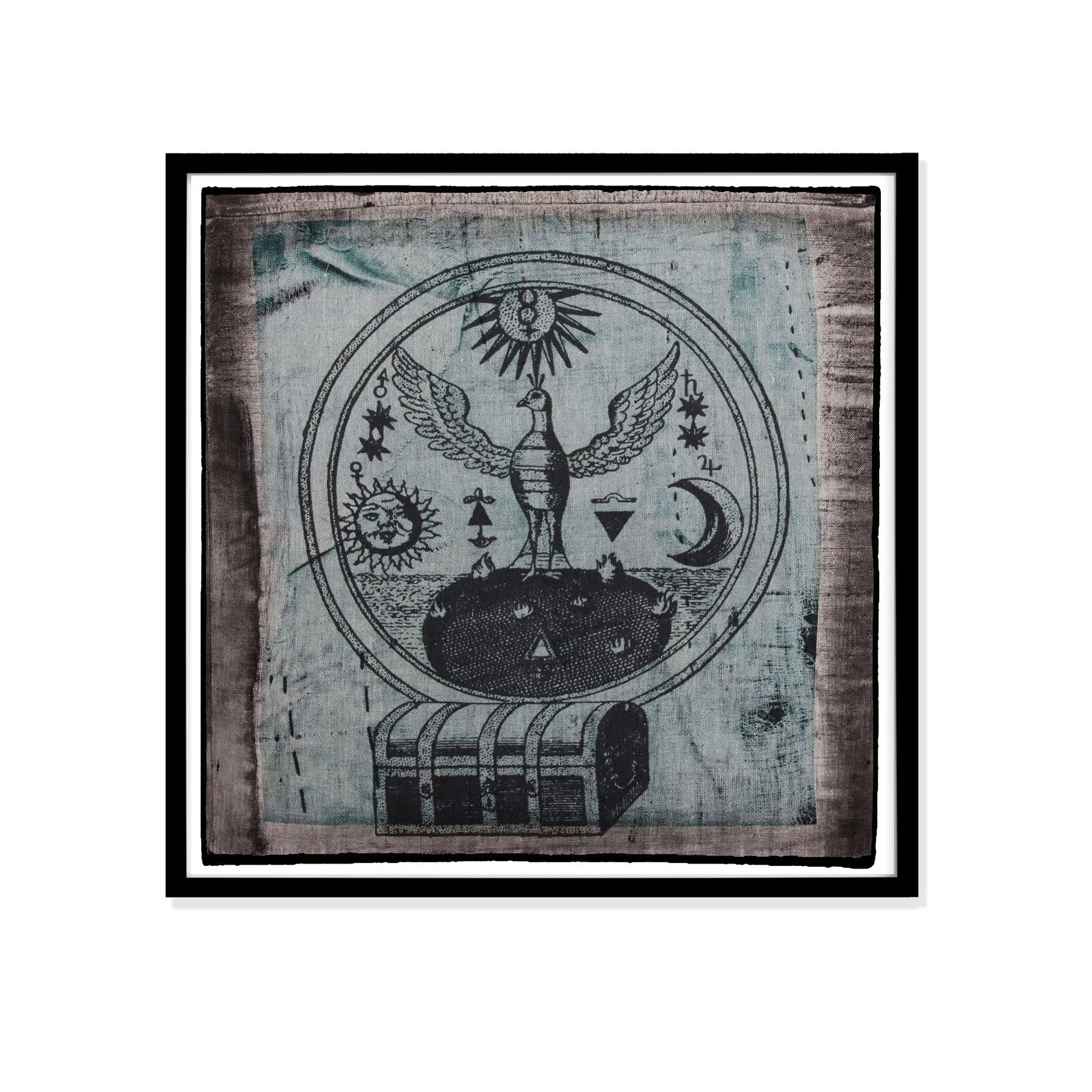 Treasure and bird illustration by Claude Paradin with antique linen in a black frame against a white wall.