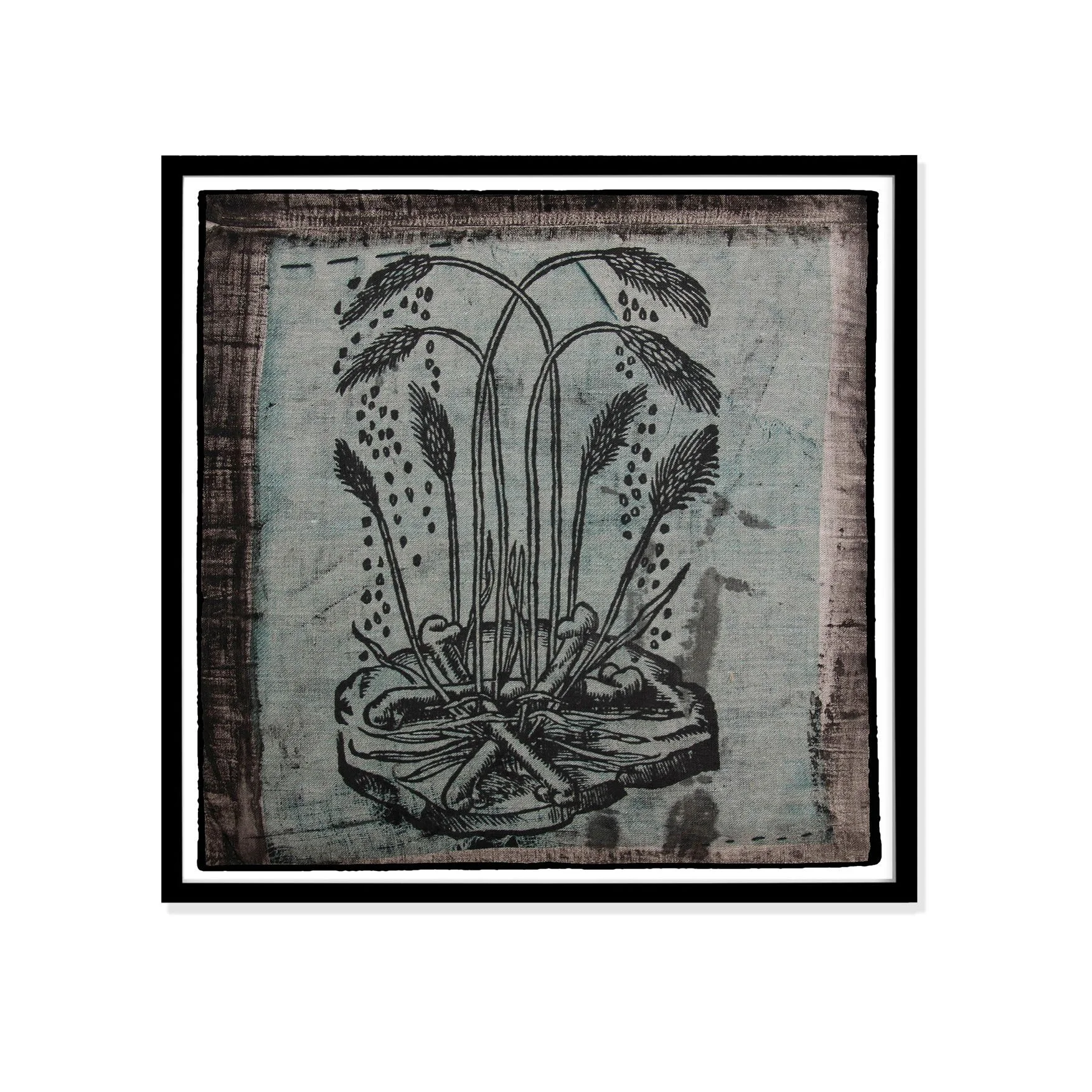 Wheat illustration by Claude Paradin with antique linen in a black frame against a white wall.