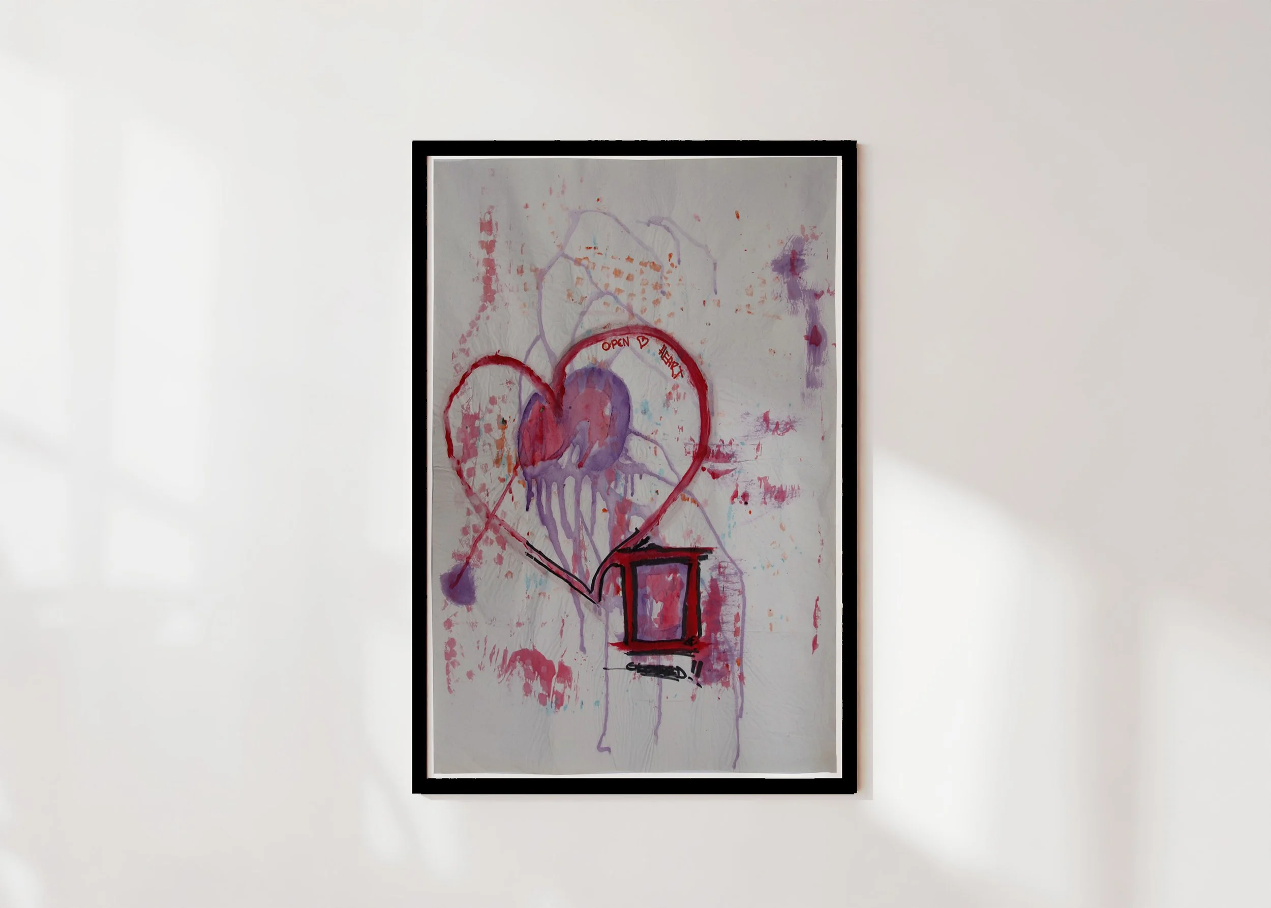 Framed print on a wall with a limited edition print of a gouache painting of an open heart by Christo Gillard for HOPONIT Studio.