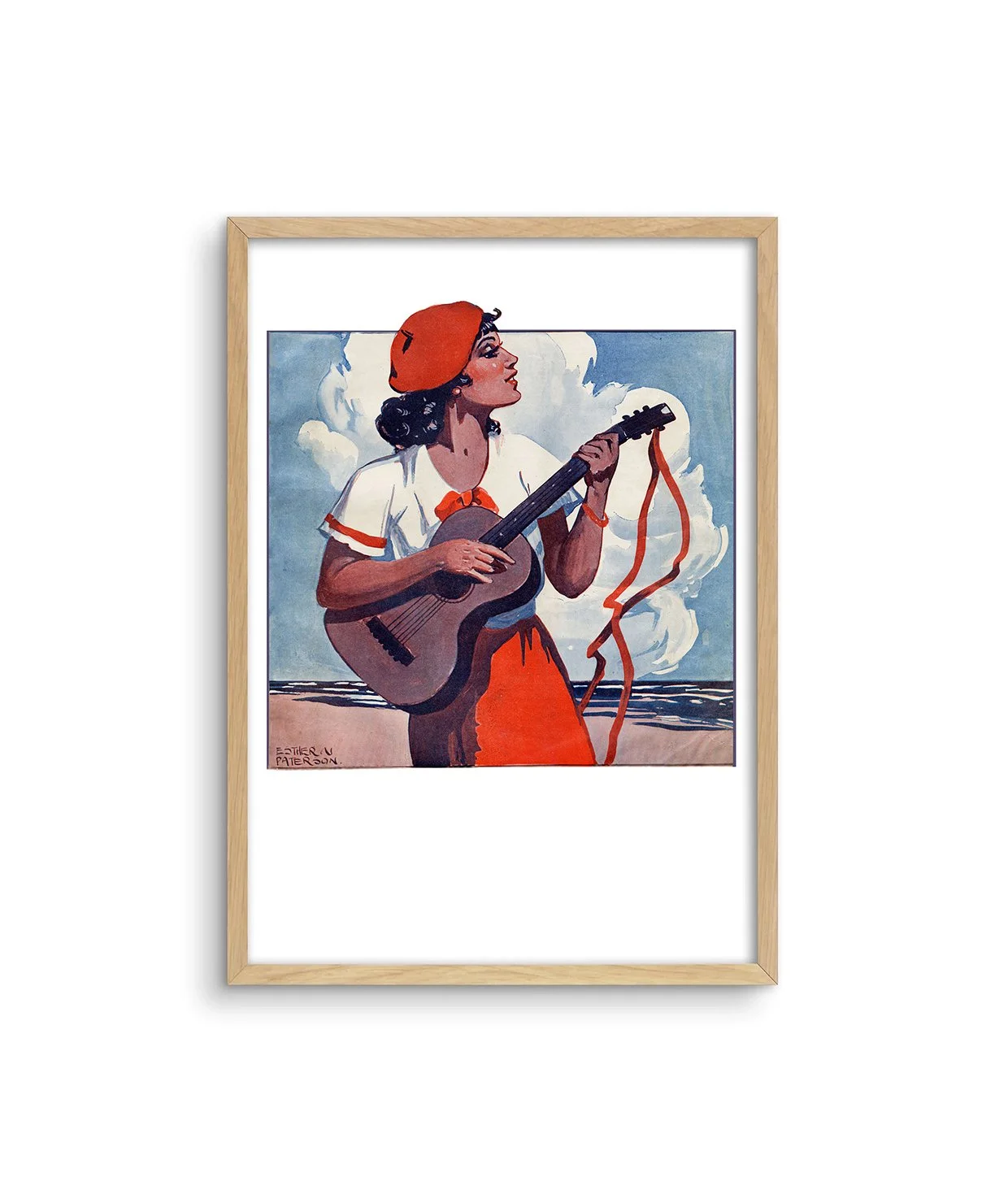 A framed print of a colourful painting by Esther Paterson of a woman with a red skirt and beret at the beach in Australia playing guitar.