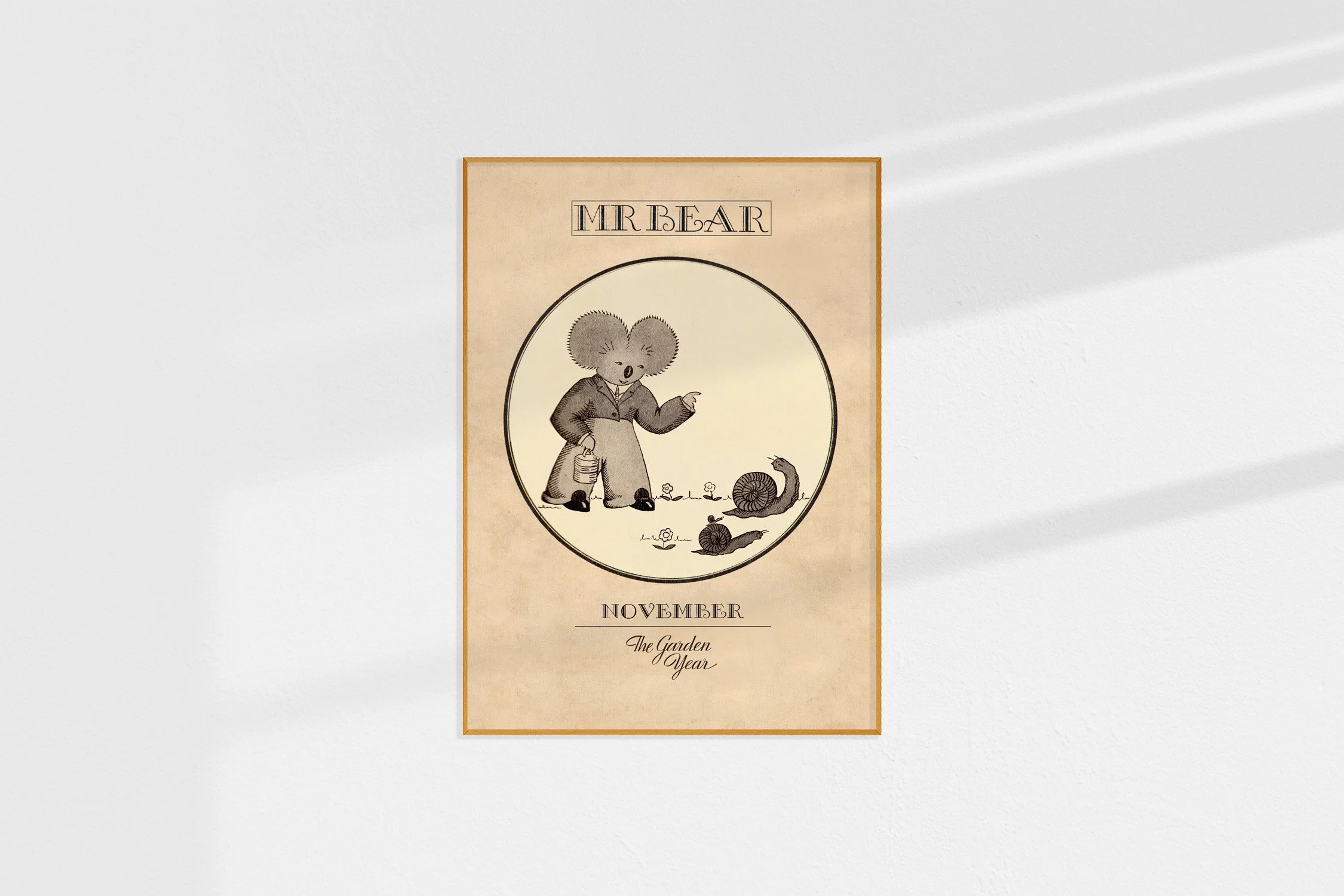 A framed Oz print of a koala Mr Bear in a roundel warning snails.