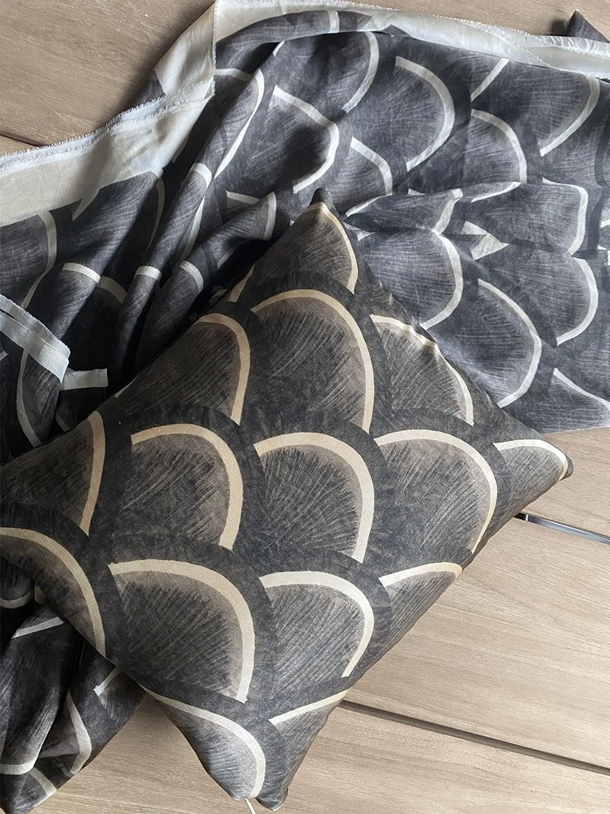 Image of Japanese kite silk cushion with a length of silk also printed with the same design.