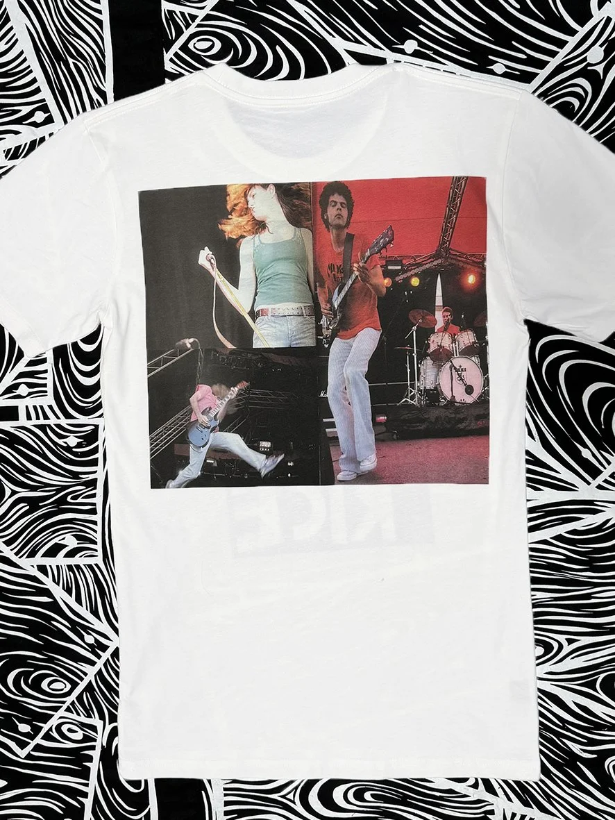 Back view of white tshirt with a large collage print of performers in the Big Day Out from Sophie Howarth's photographs.