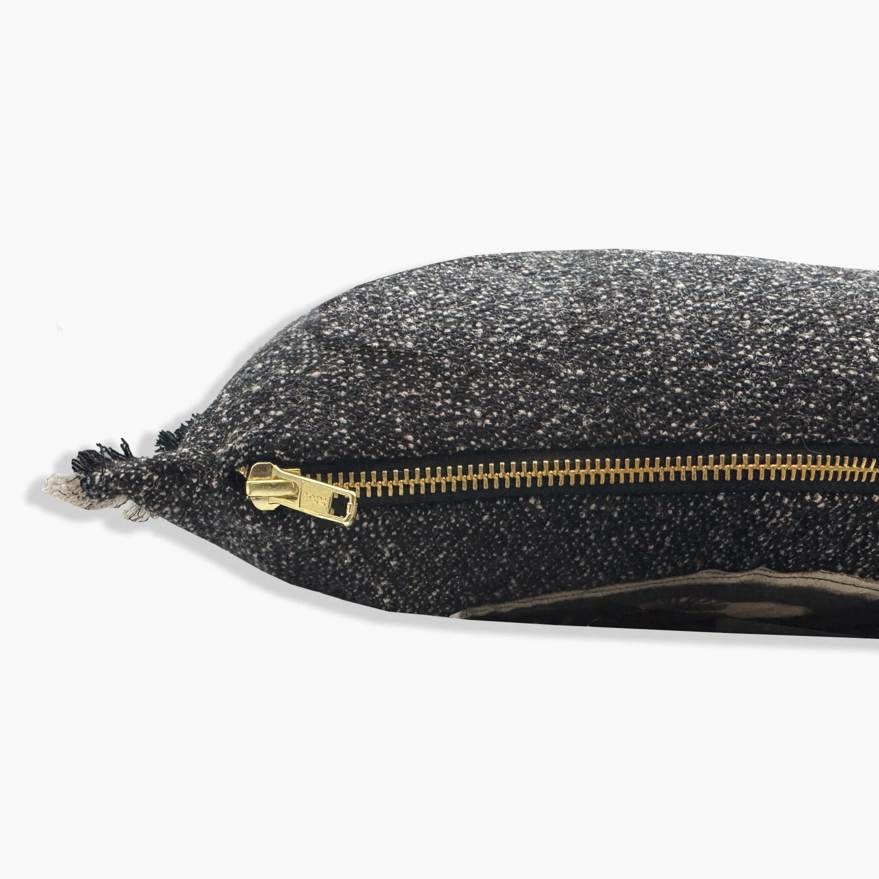 Side view of cushion showing gold YKK zip.