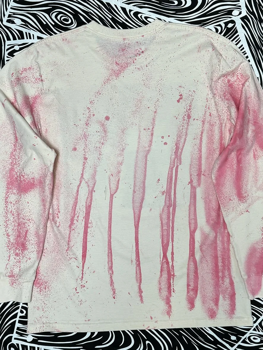 Back view of a natural long sleeved tee with oxidised treatment in pink.
