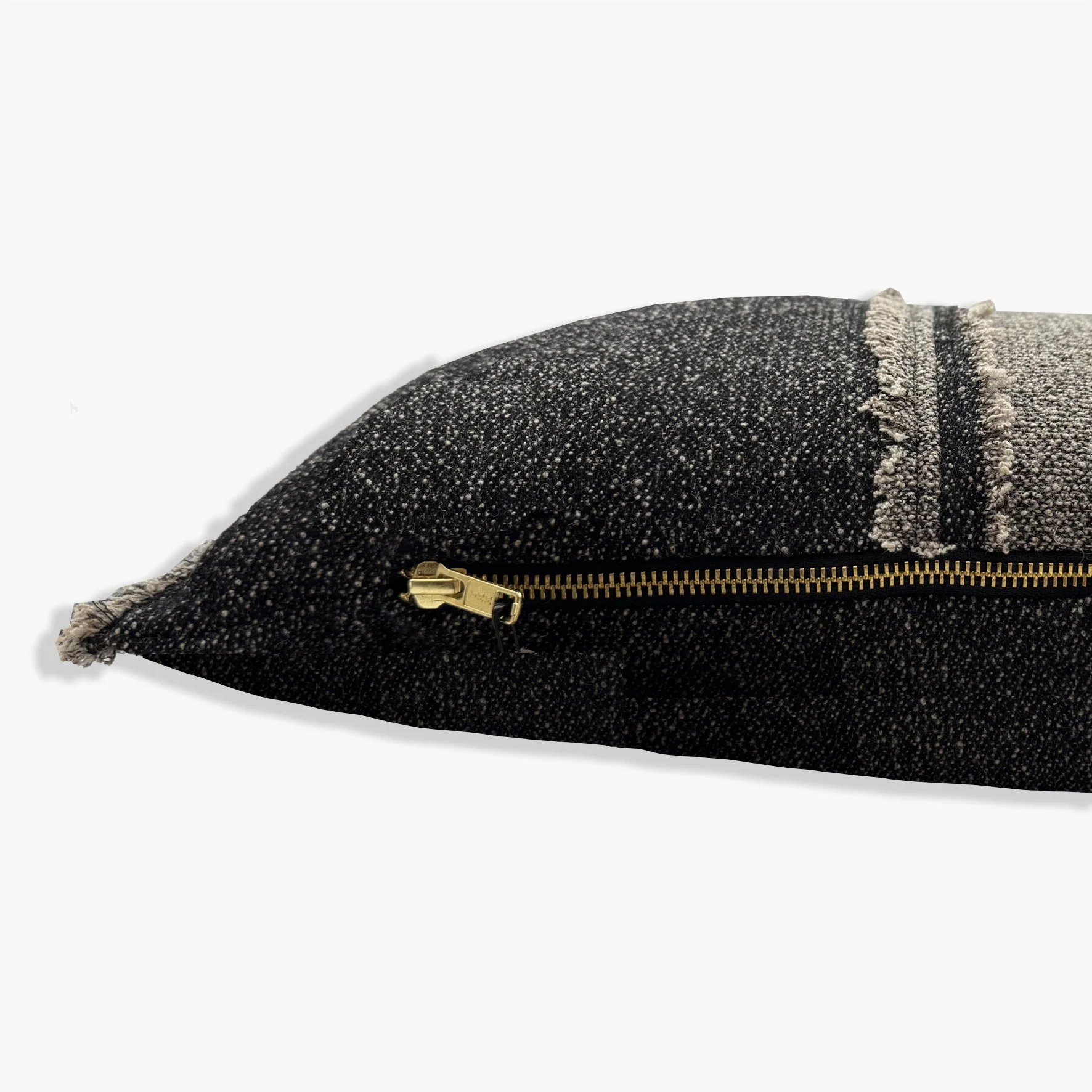 Side view of cushion showing gold YKK zip.