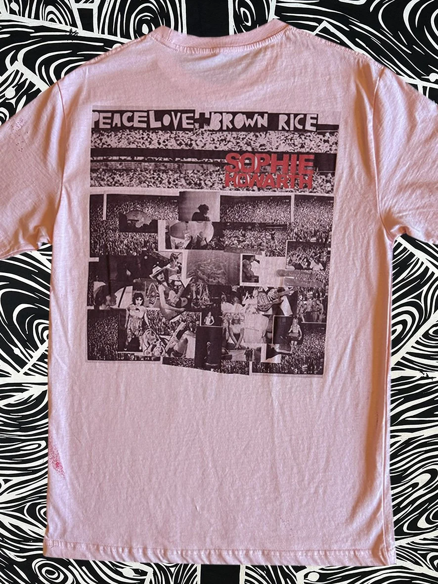 Back view of a treated pink tshirt and with a large Peace Love and Brown Rice print.