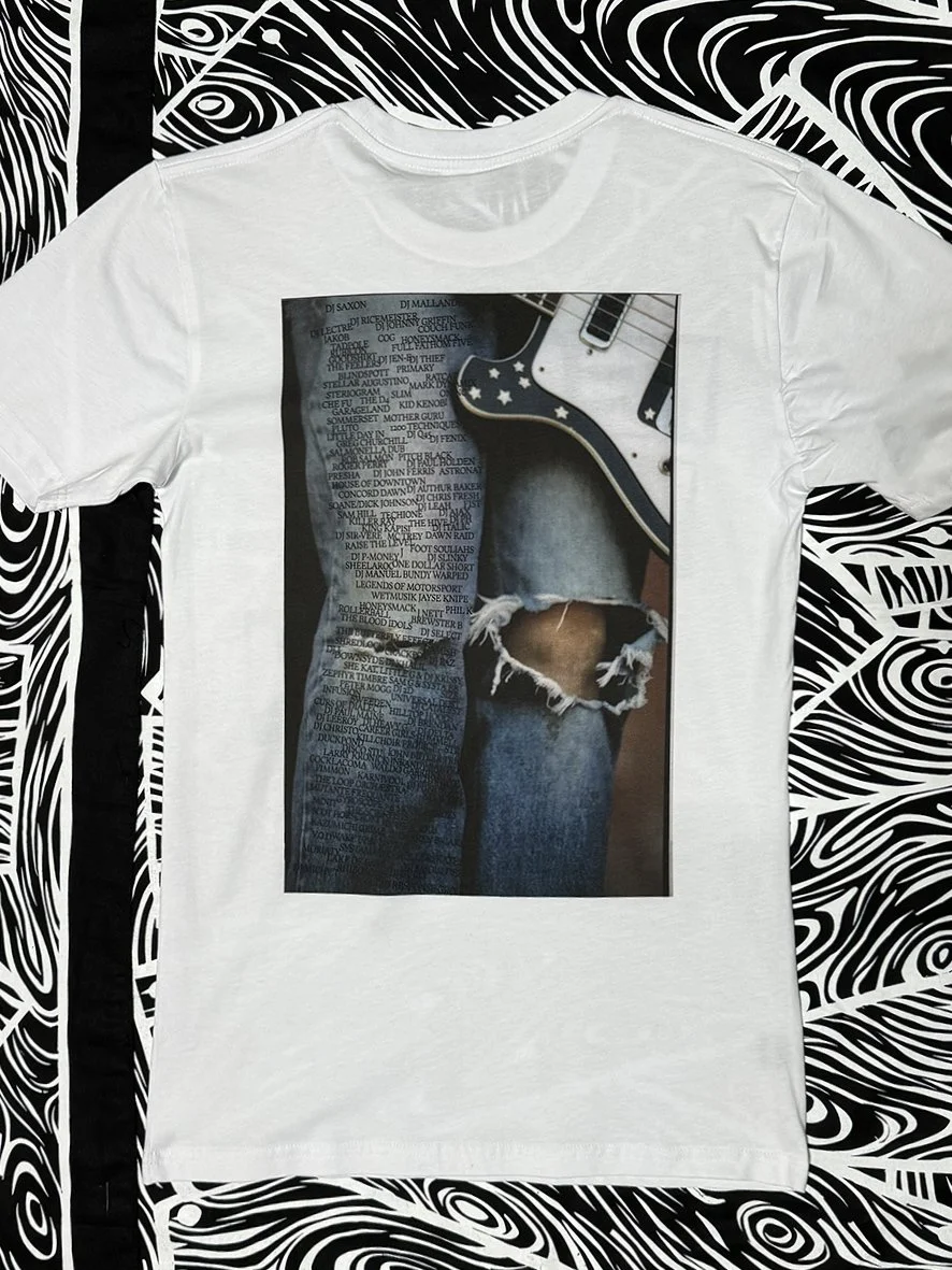 Back view of white tee with a Sophie Howarth guitar image and bands and DJs from the Big Day Out.