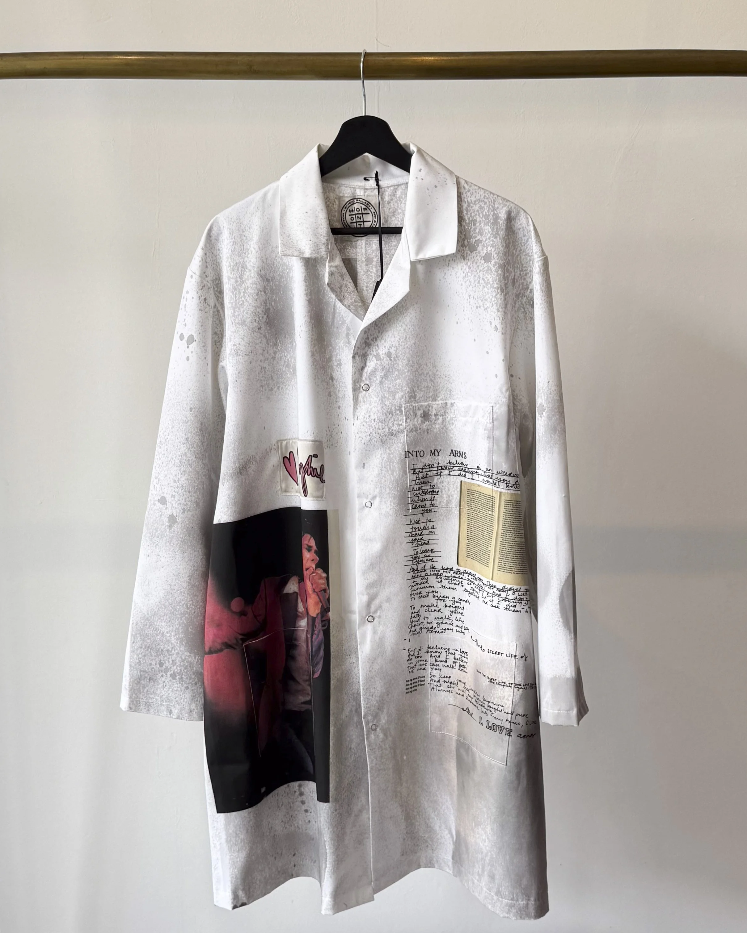 Front view of art lab coat with oxidised treatment and Sophie Howarth's images of Nick Cave and Into my Arms music.