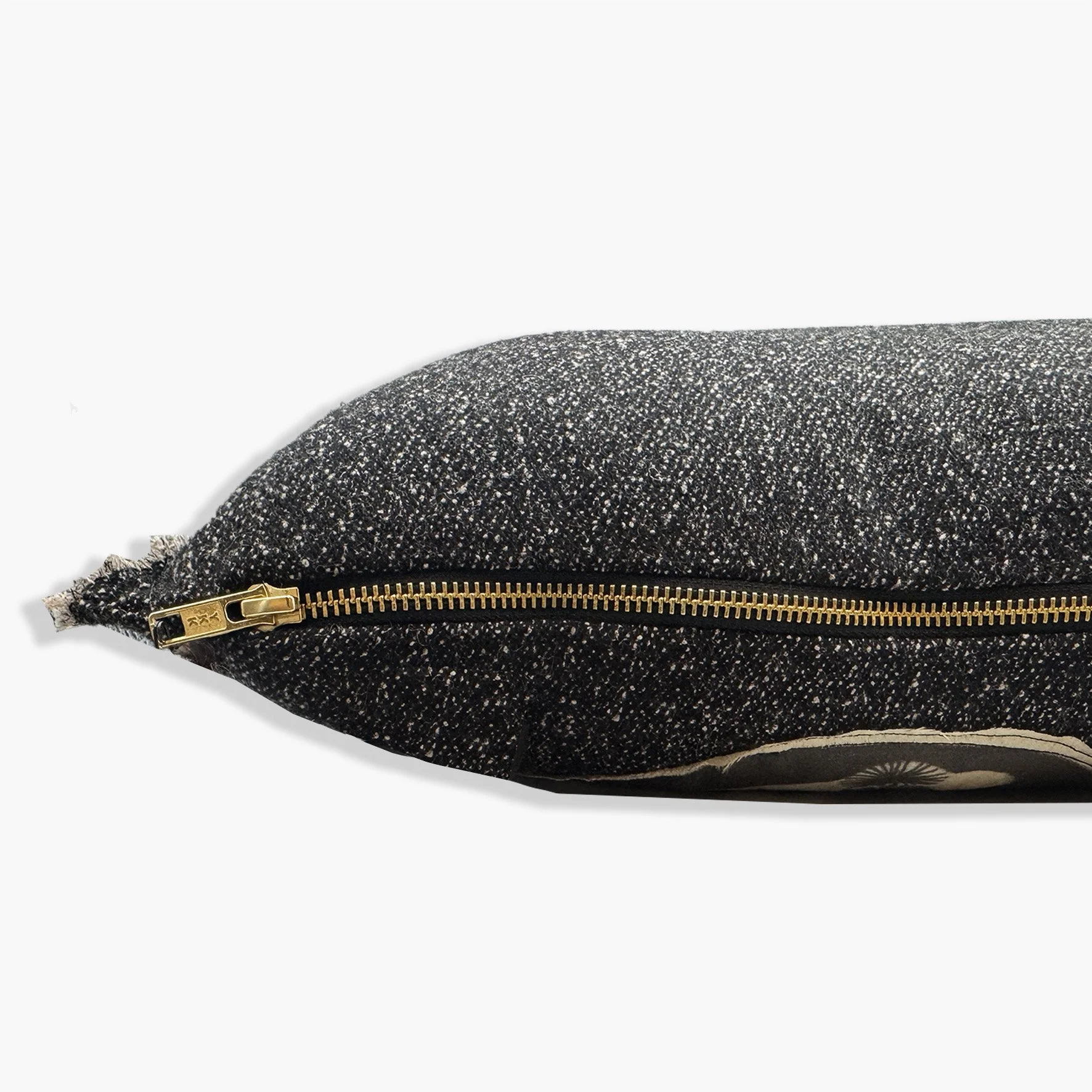 Side view of cushion showing gold YKK zip.