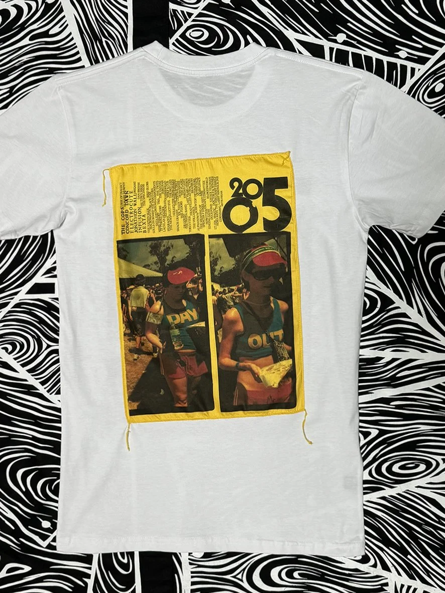 Back view of white short sleeved tee with a large Peace Love and Brown Rice patch by Sophie Howarth printed onto yellow chintz.