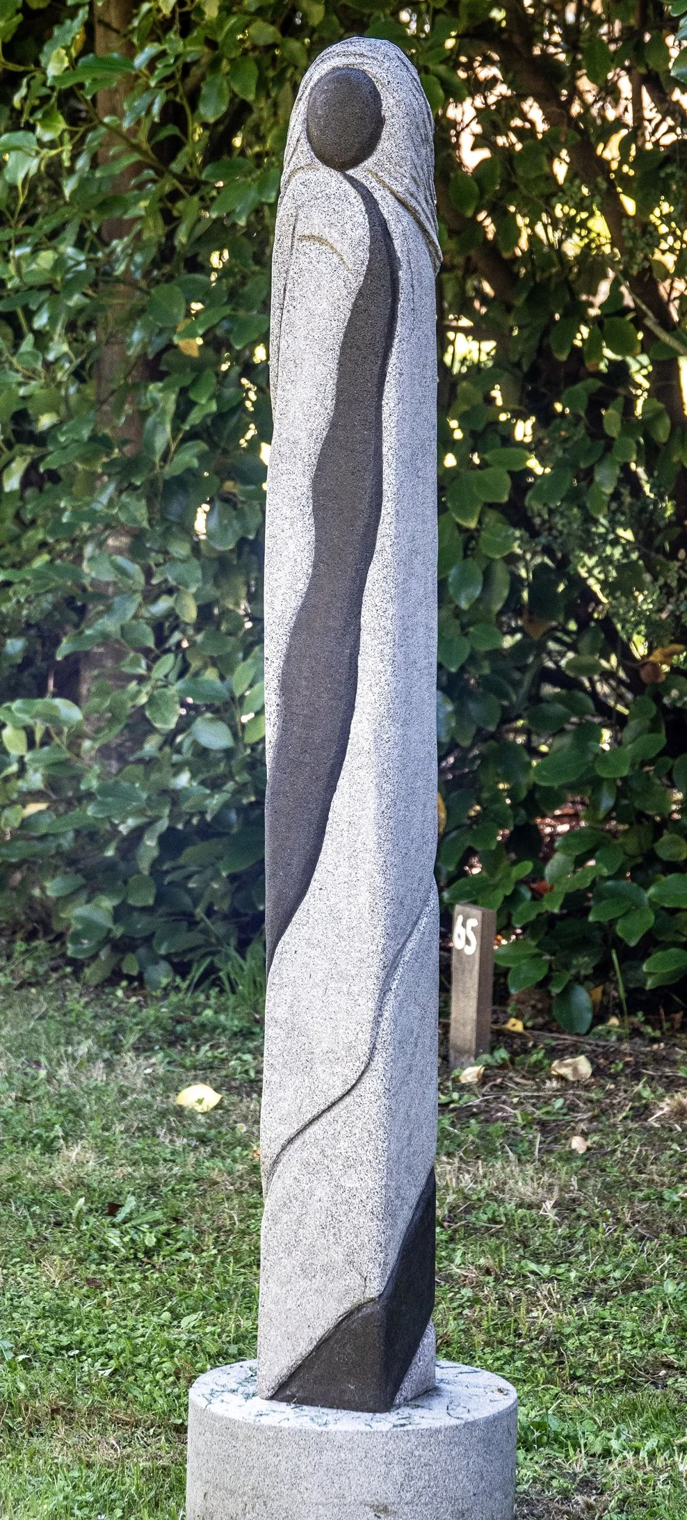  65. Debbie Templeton-Page 
  Swirling   
 (2026)
 Timaru bluestone (basalt)
 1180 x 125 x 125mm, base 150 x 310mm
 $2,300