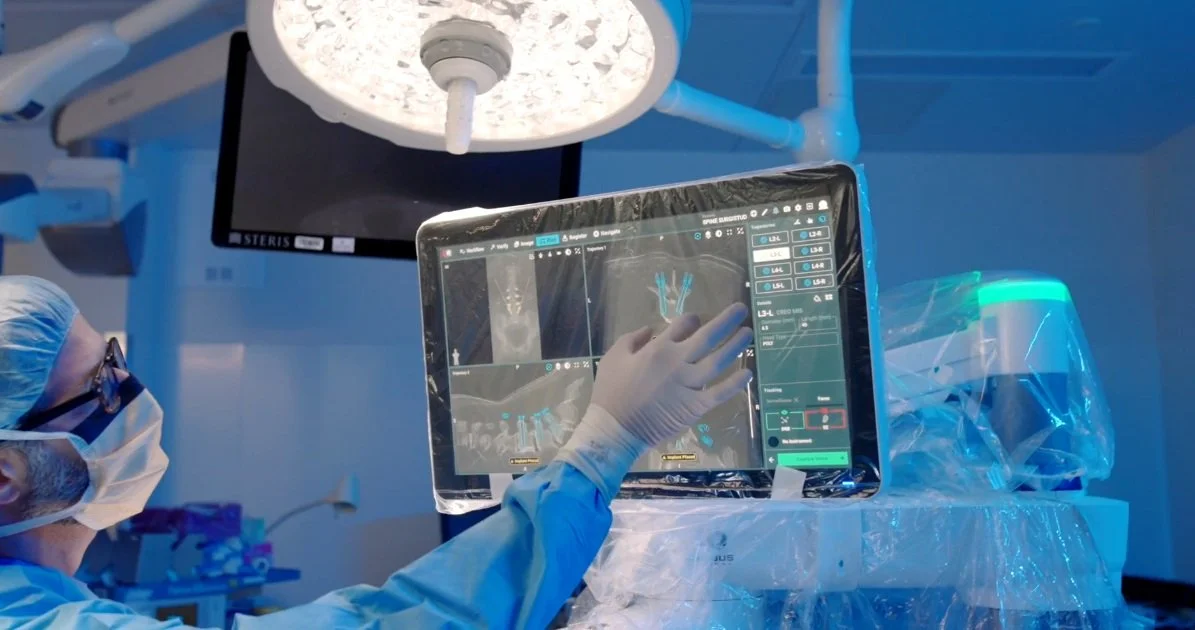 Dr. Robert Ames planning robotic-assisted spine surgery on the navigation screen