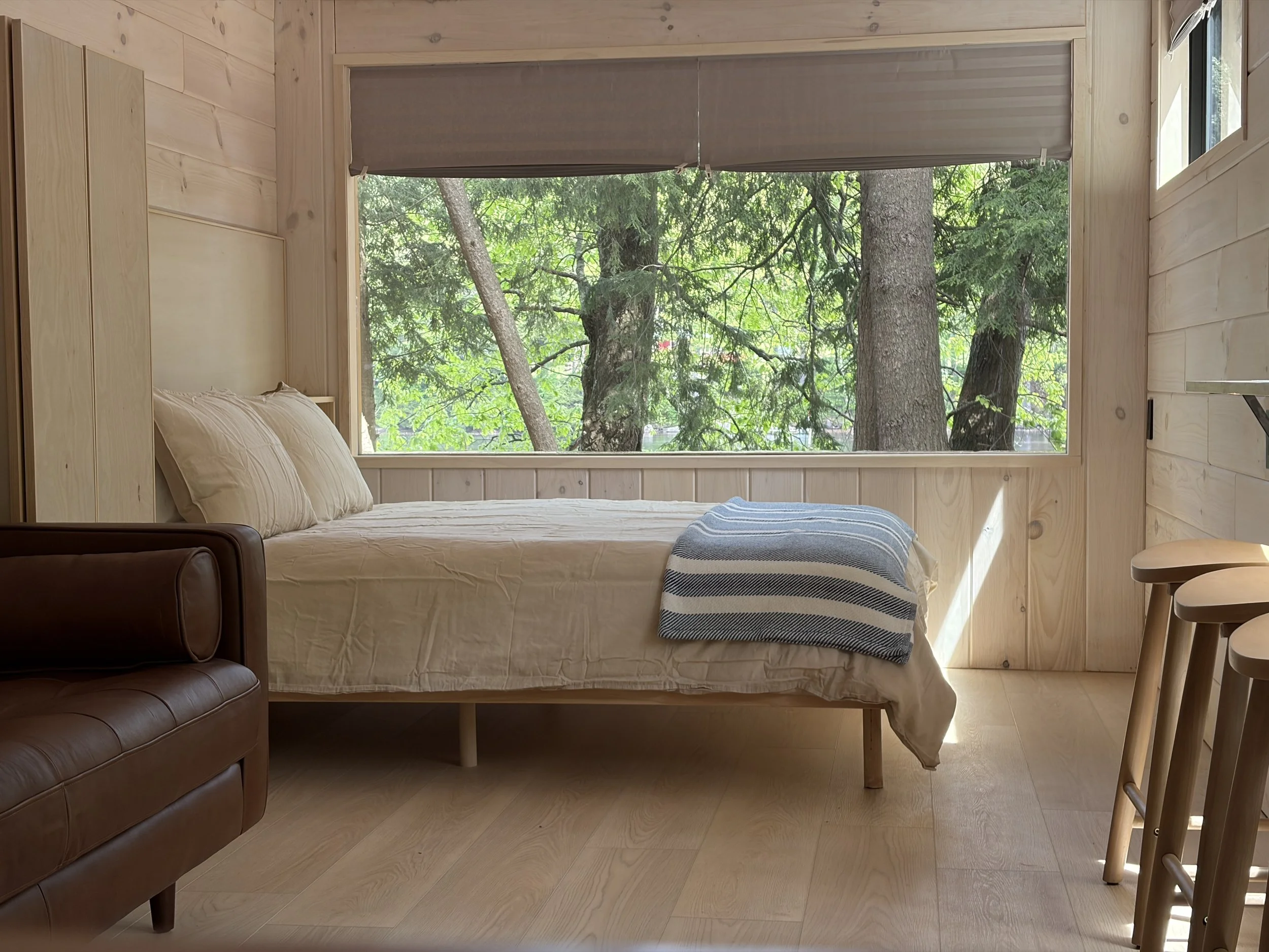 This is the Chestnut cabin with river views and a cozy set up inside.