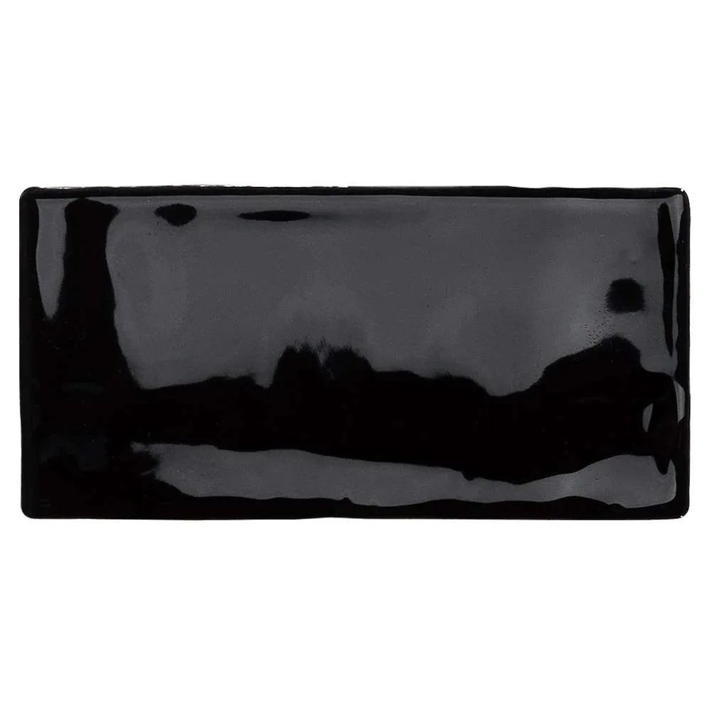 Glossy black subway tile from the Venice collection, ideal for bathroom walls that demand elegance.
