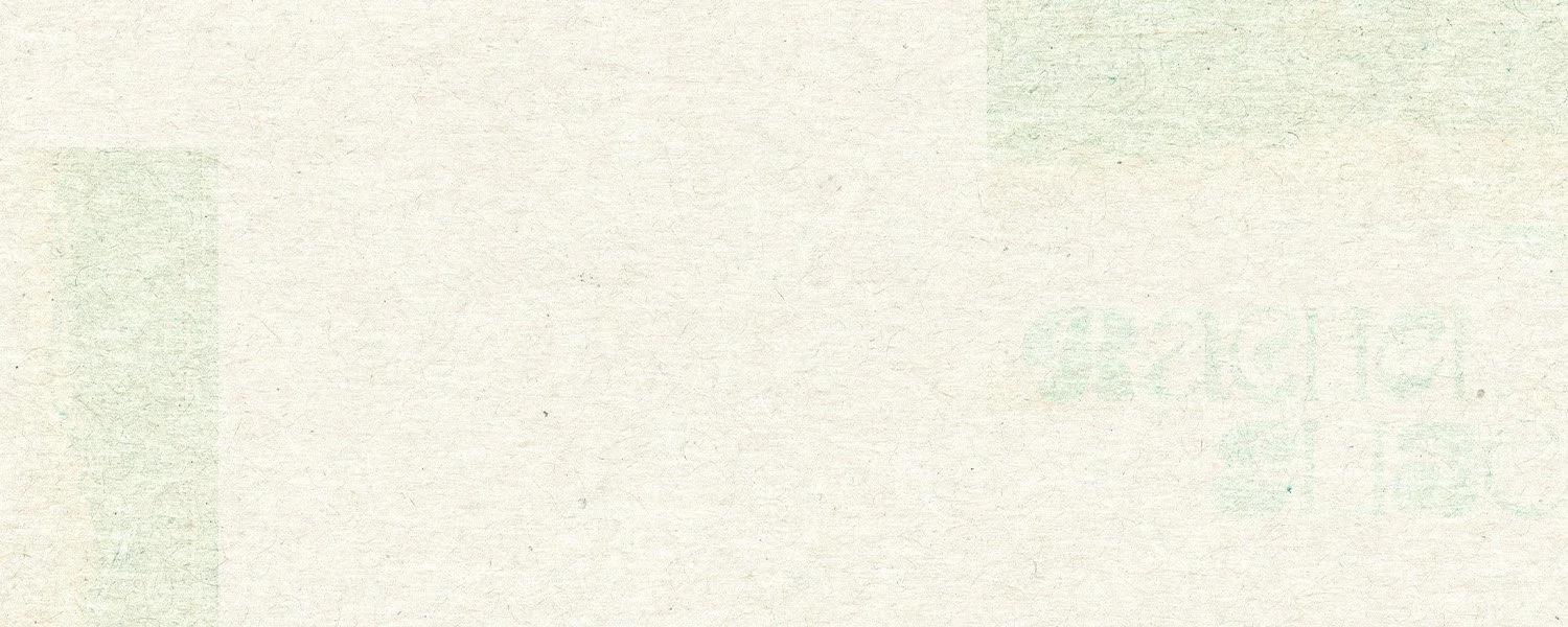 Blank off-white paper with light green printed text and design.