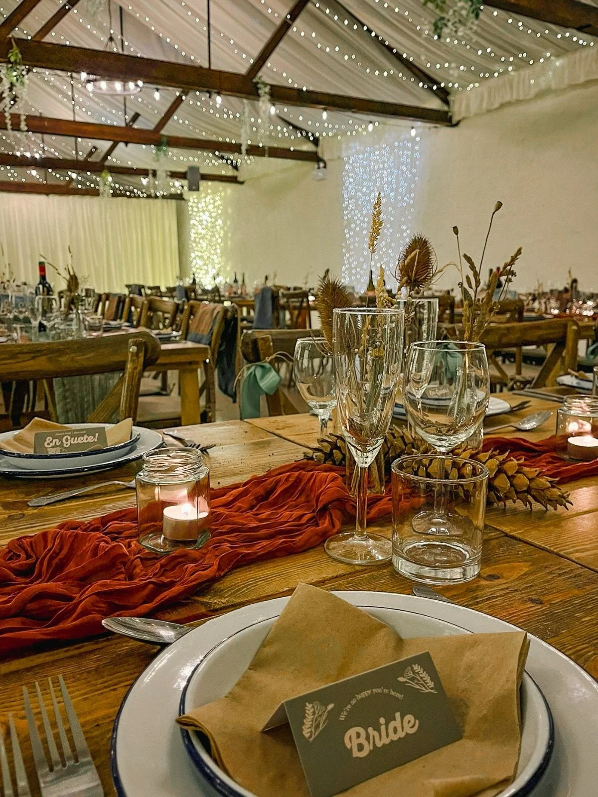 Anna &amp; Scott | 28th February 2026 🤍✨

A&amp;S kept the rustic vibes throughout the venue, with rustic tables and chairs, and pinecones tucked through each table. With pops of colour from the table runners, dry florals in bud vases and stationery